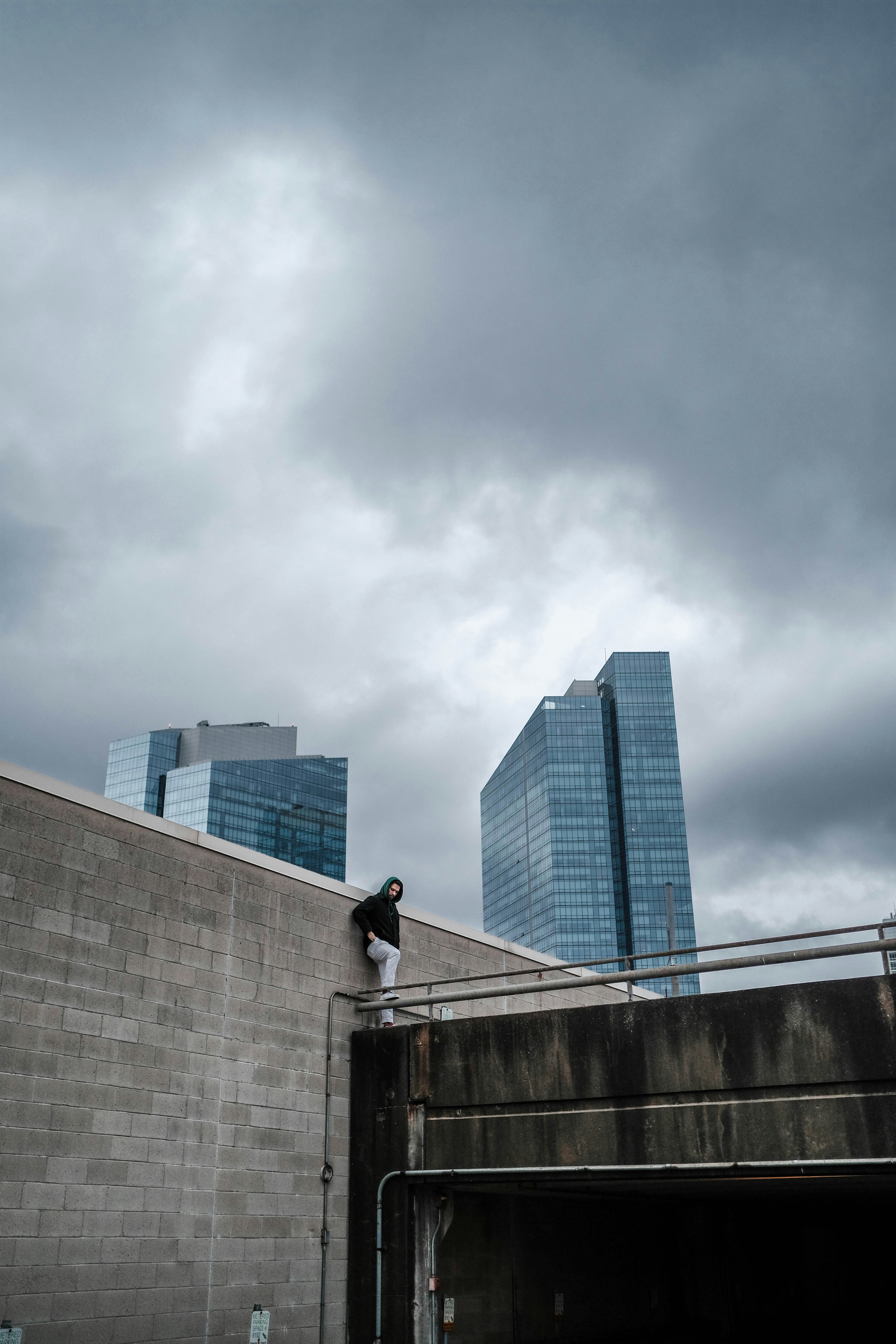 Lone Man on Urban Rooftop