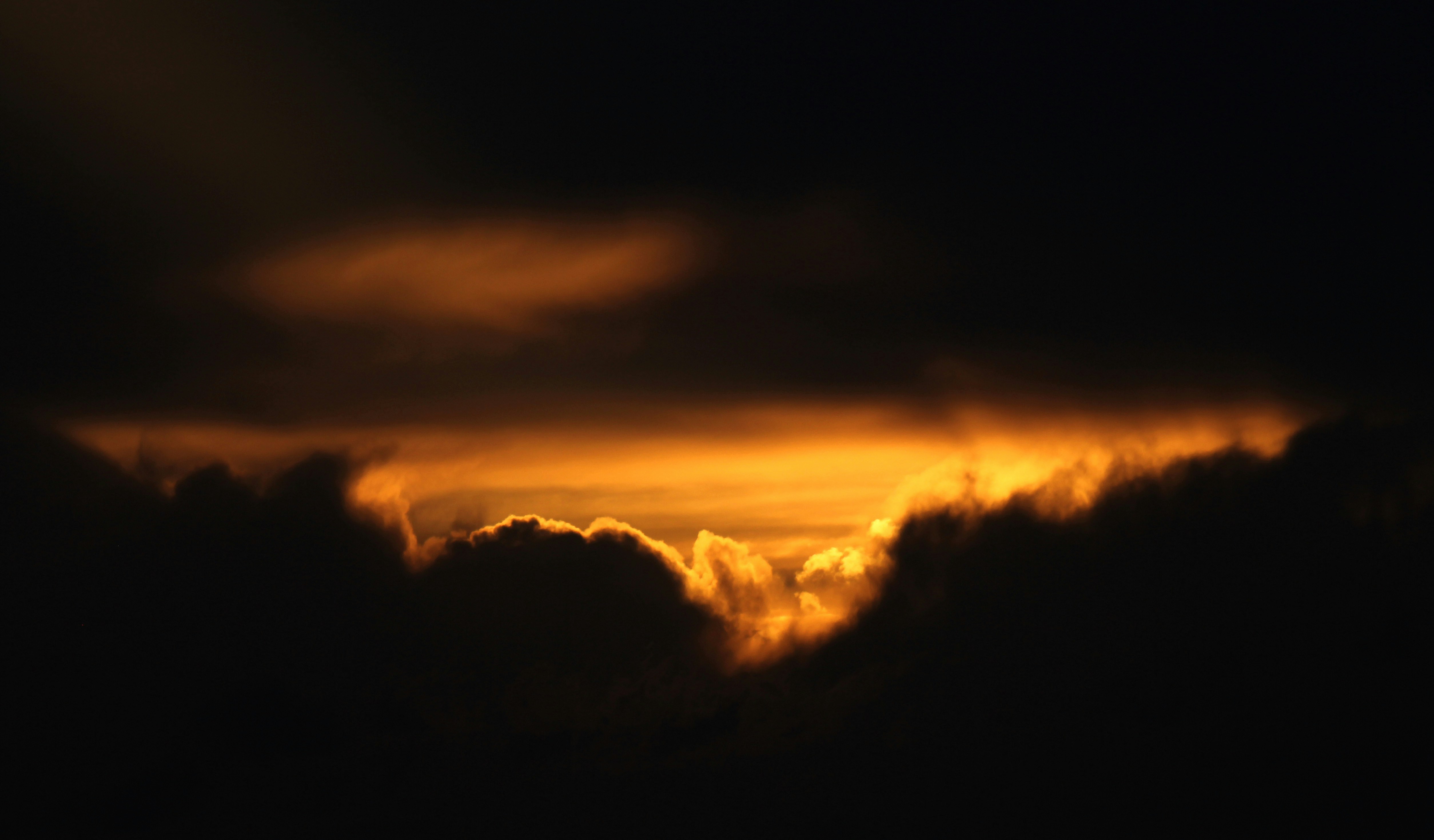 Golden Light Through Dark Clouds