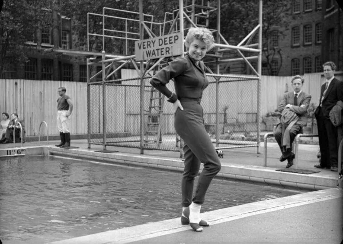 Woman Posing by Deep Outdoor Pool