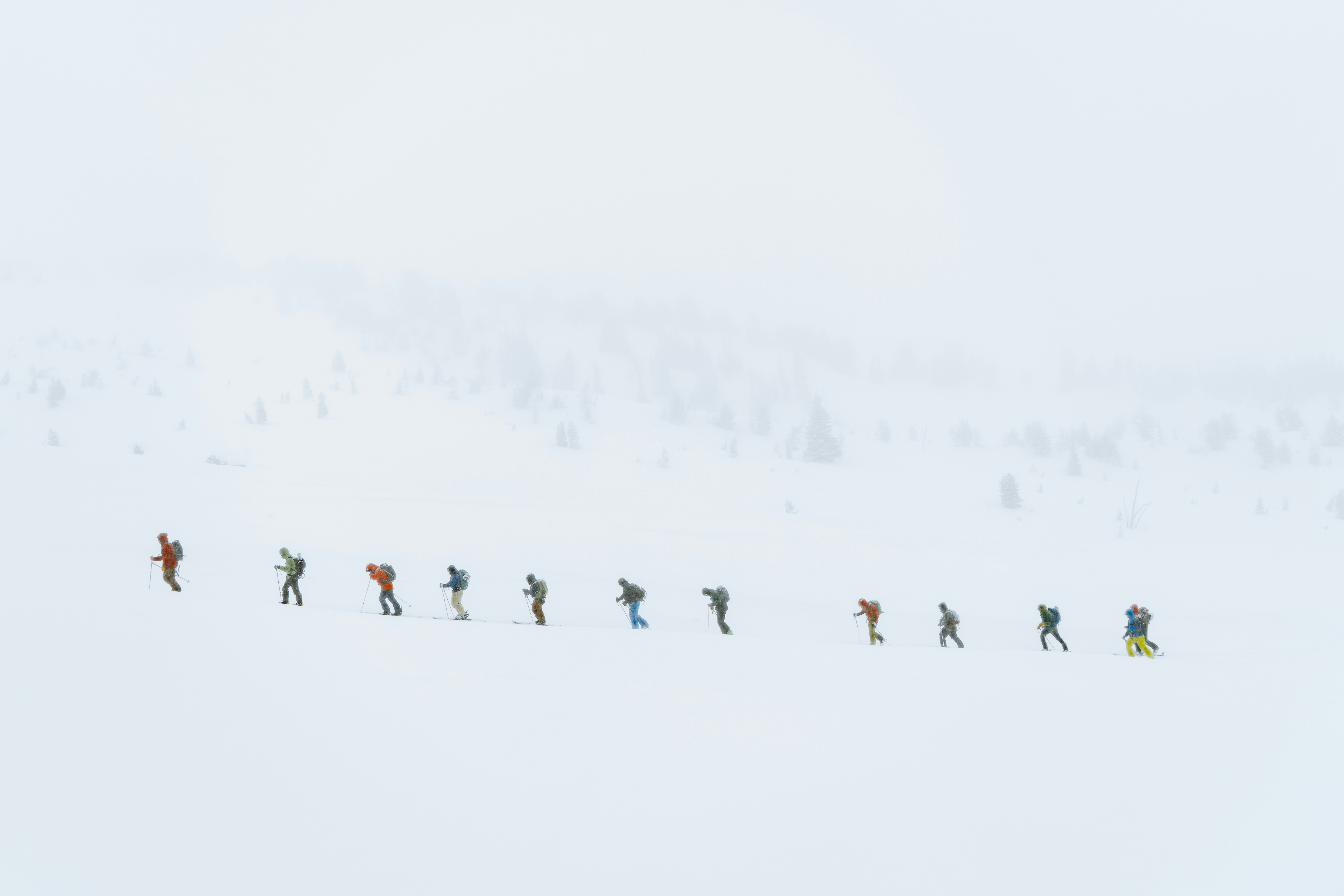 Hiking Team Crossing Snowy Slope