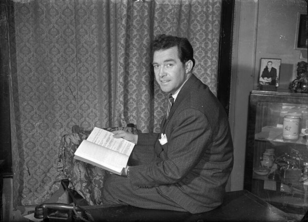 Vintage Portrait of Man Holding Open Book