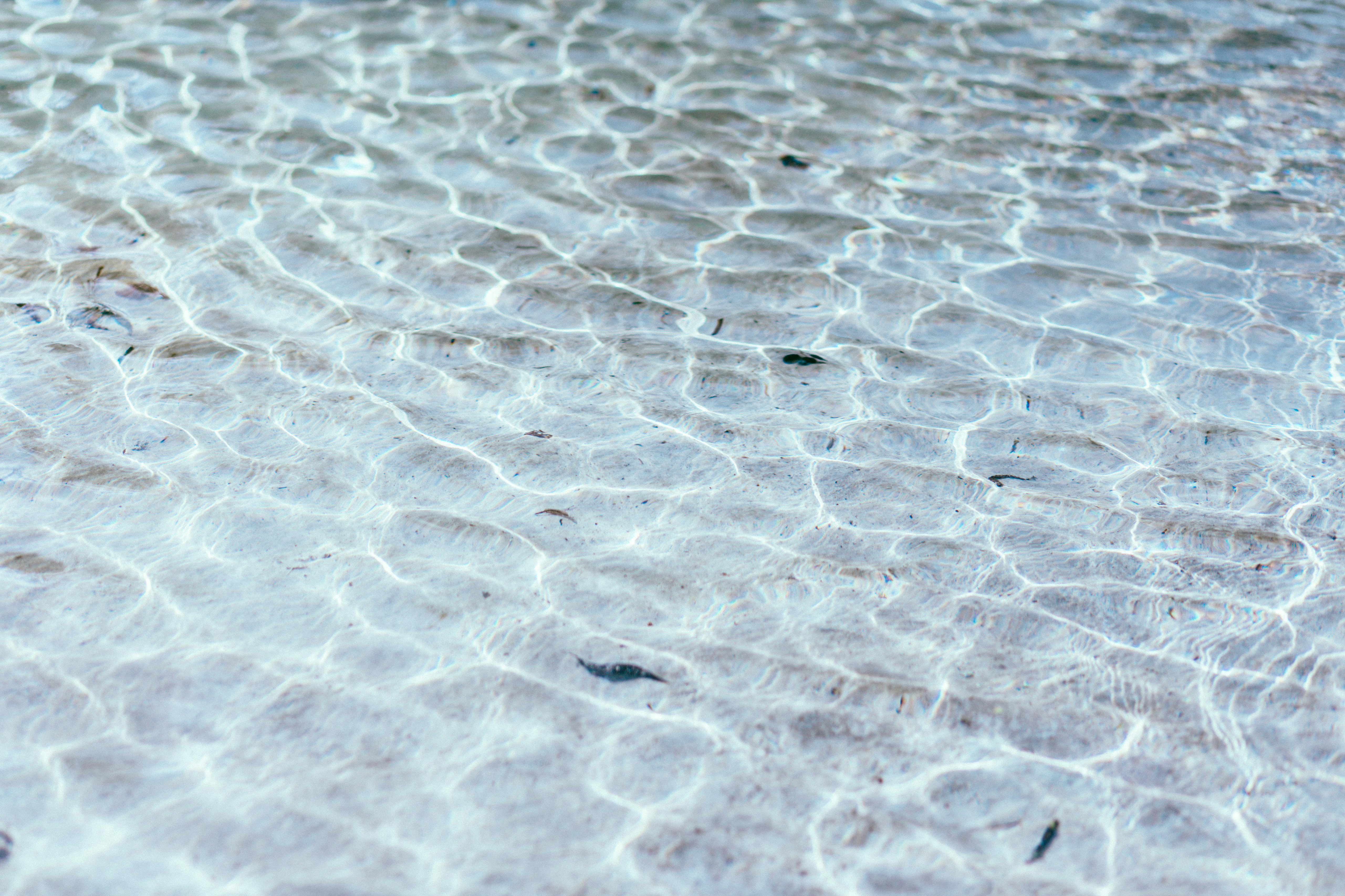 Clear Shallow Water Ripples Over Sand