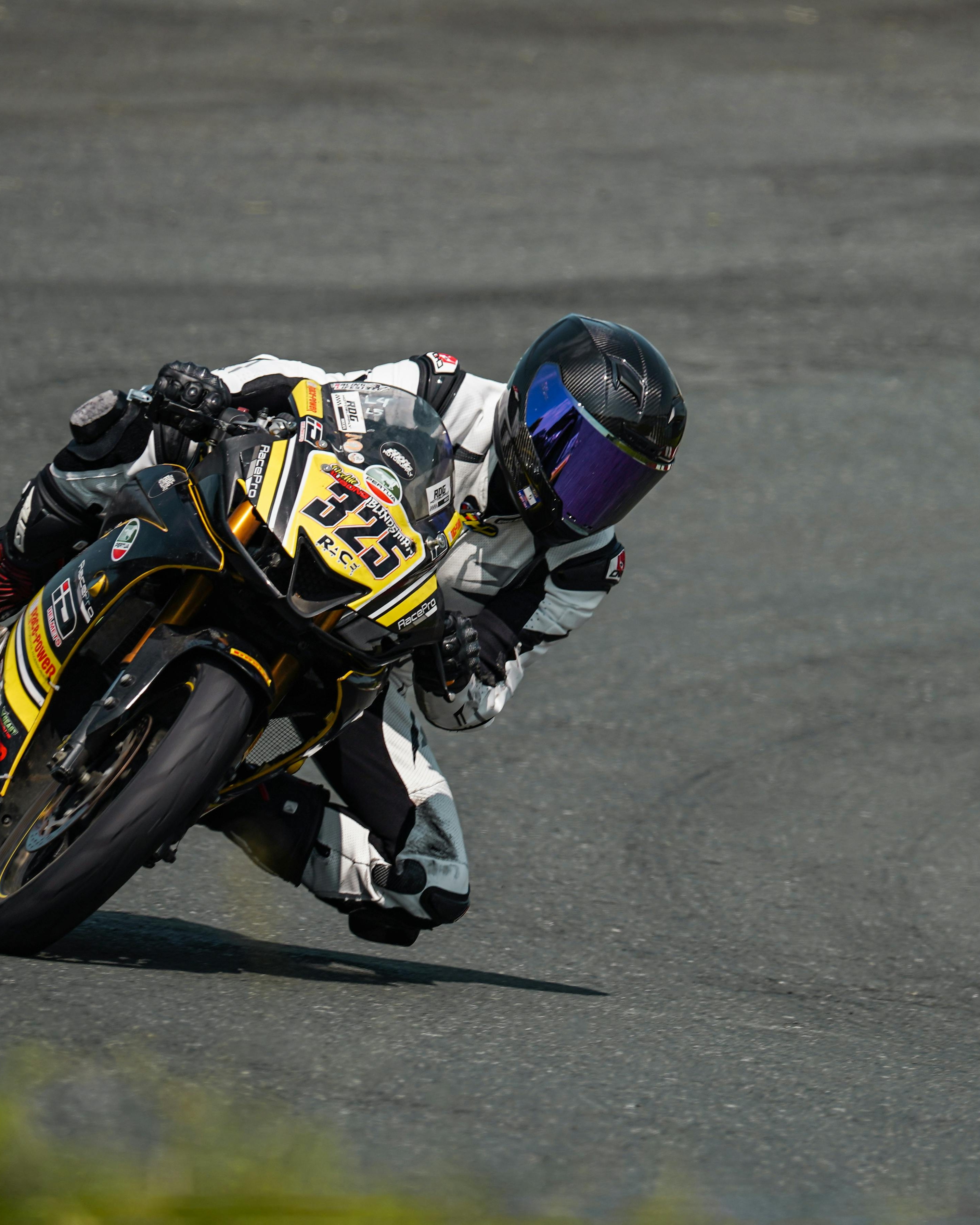 Motorcycle Racer Leaning Into Turn