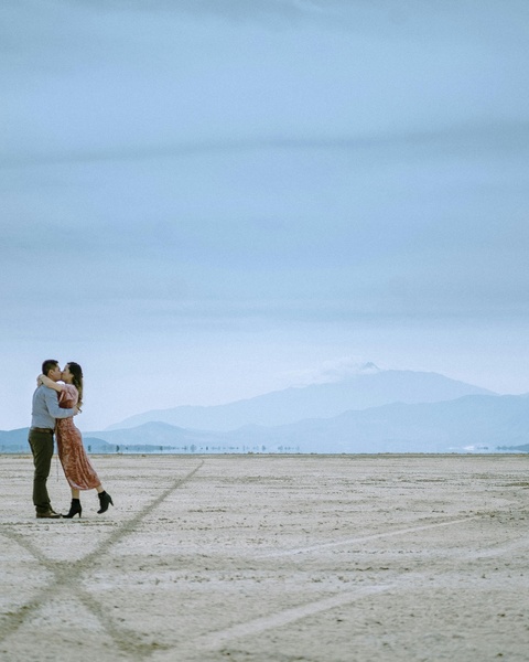 Couple Kissing on Vast Dry Plain