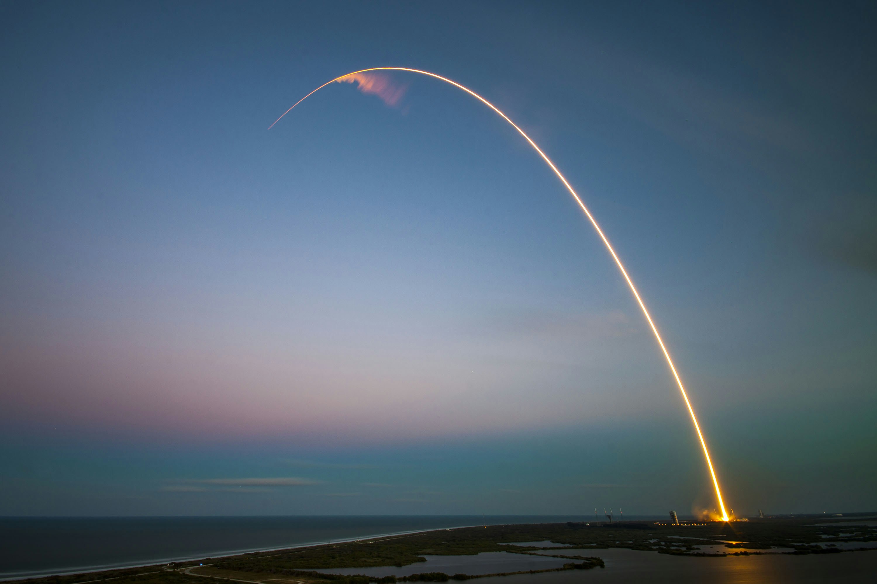 Rocket Launch at Dusk Over Coast