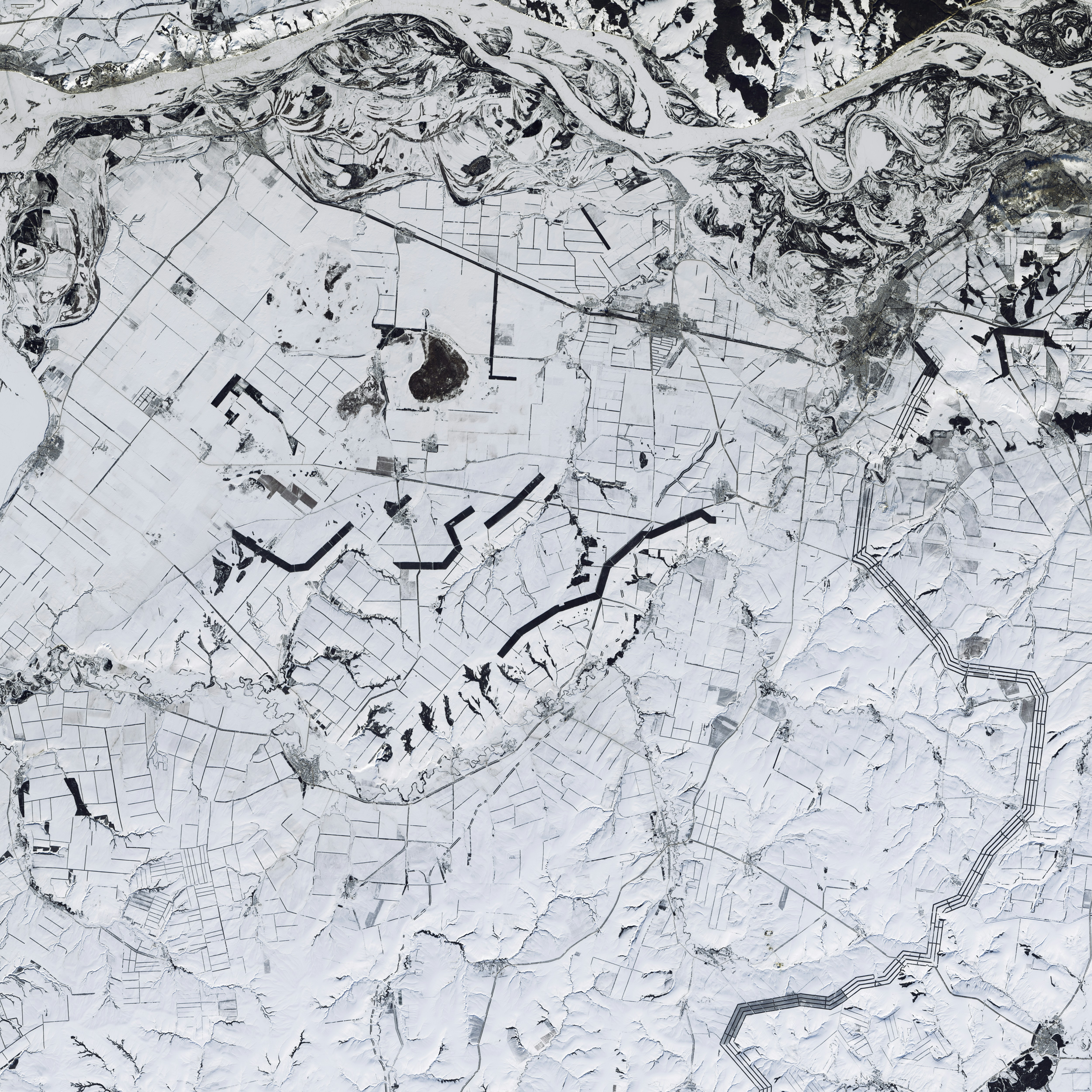 Aerial View of Snow-covered Farmland