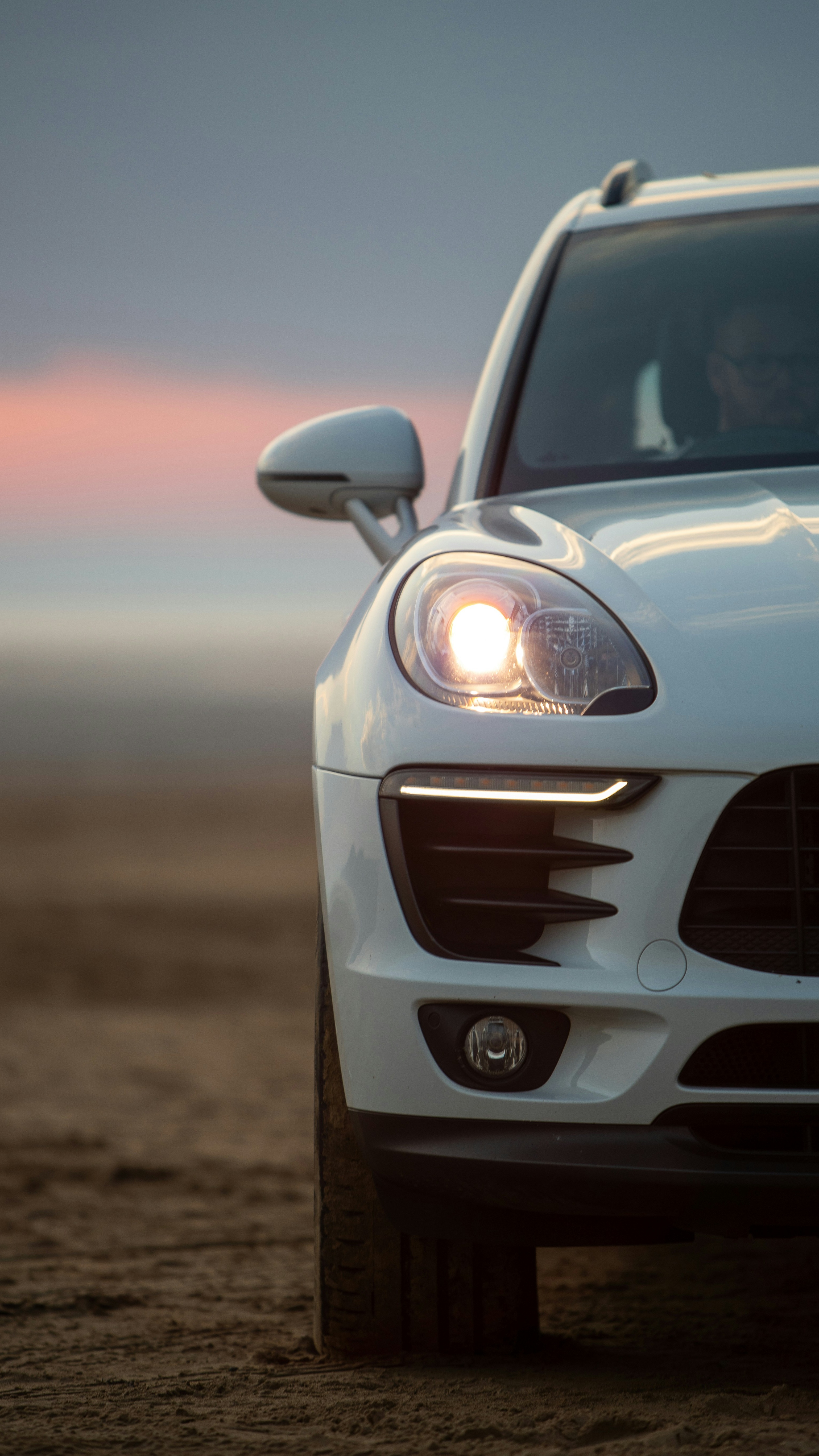 White SUV Parked At Sunset