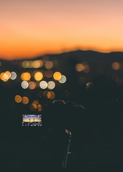 Camera Capturing Sunset Bokeh View
