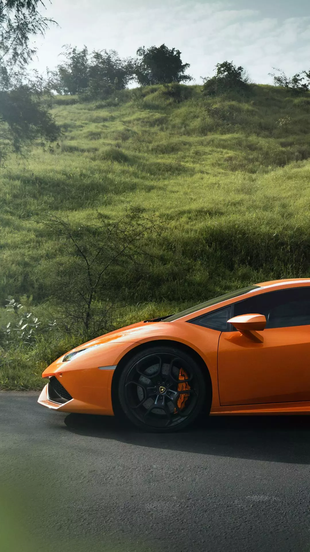 Orange Lamborghini on Hillside Road