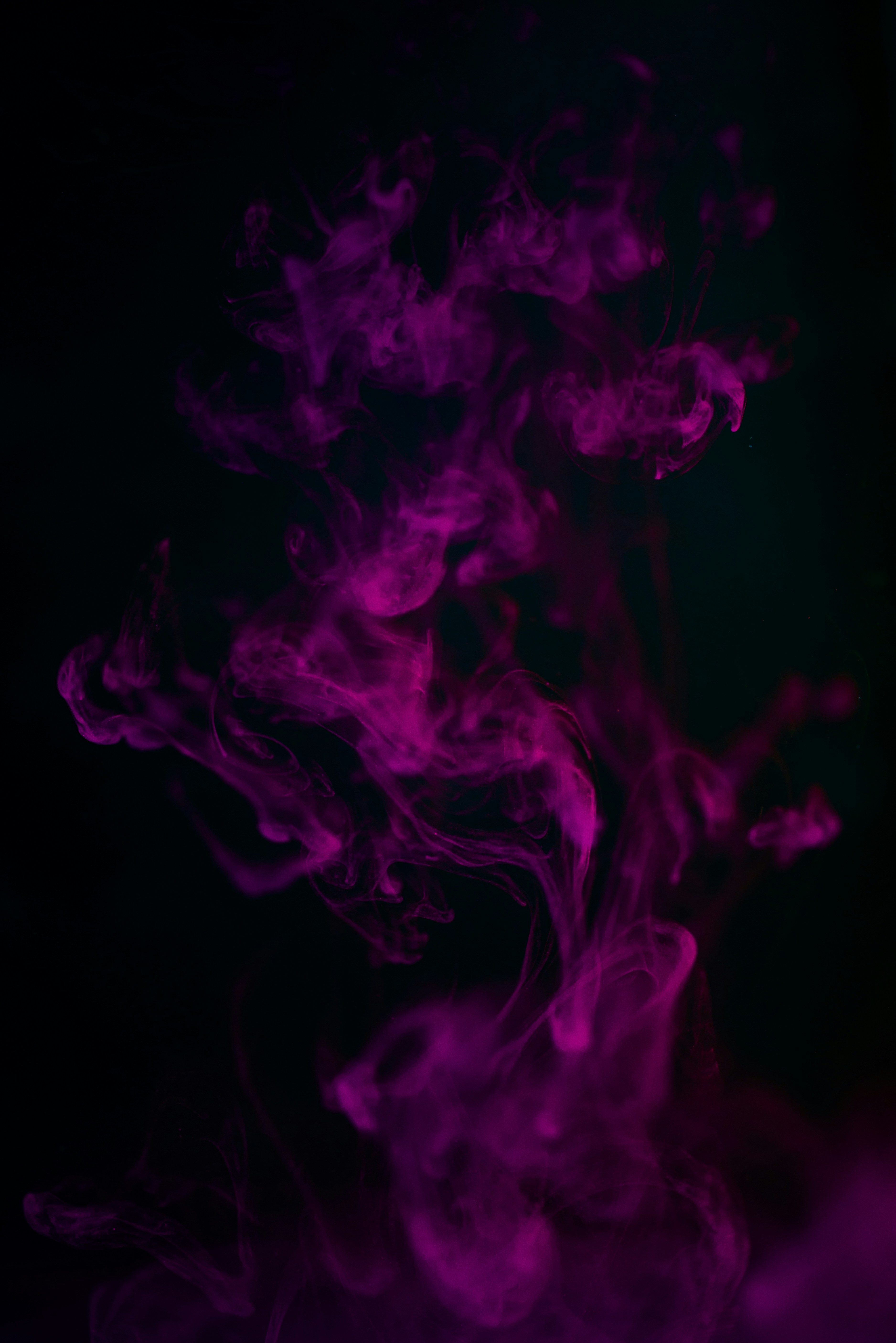 Purple Smoke Against Black Background — Abstract Backgrounds