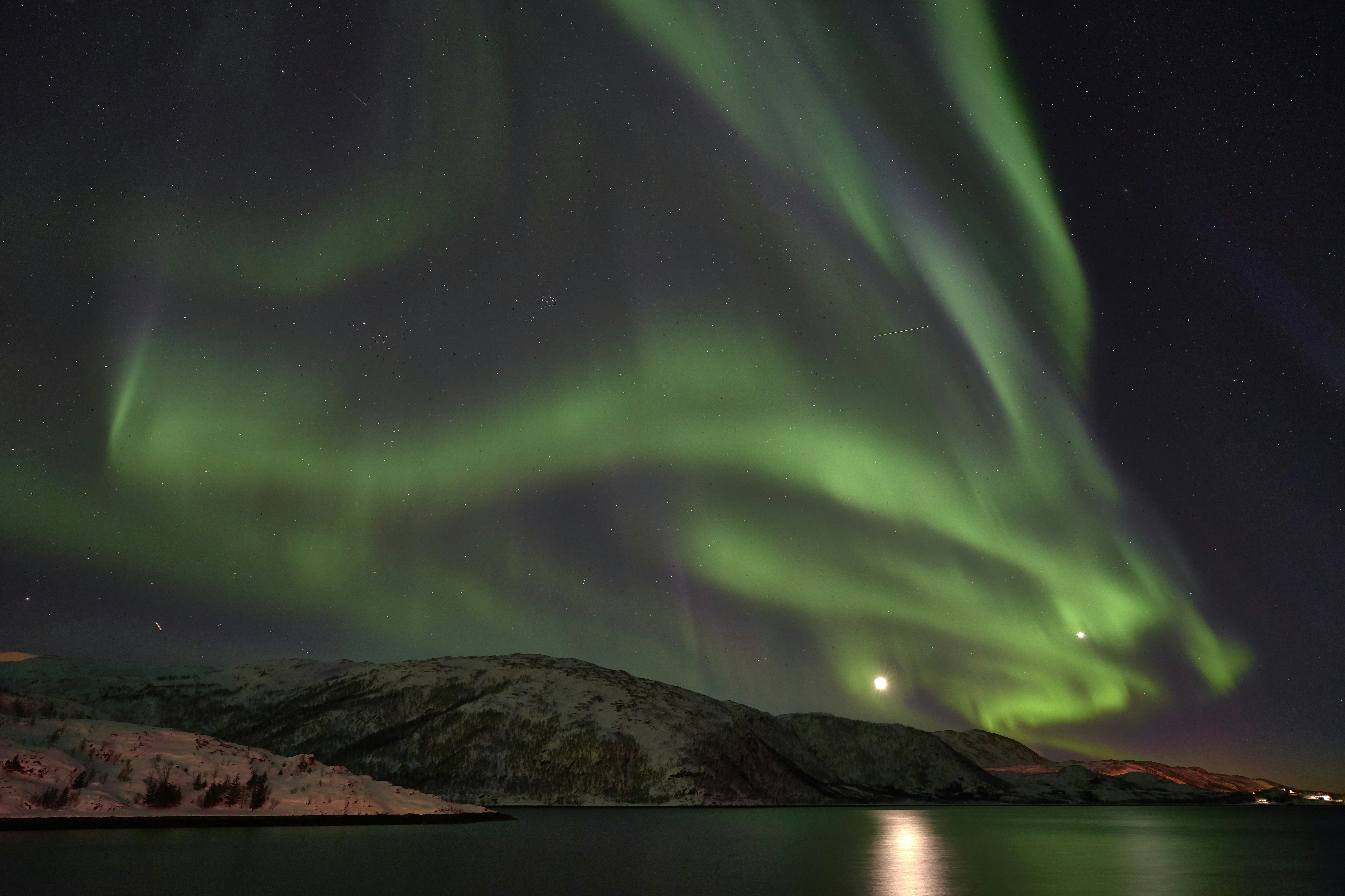 Northern Lights Over Snowy Fjord