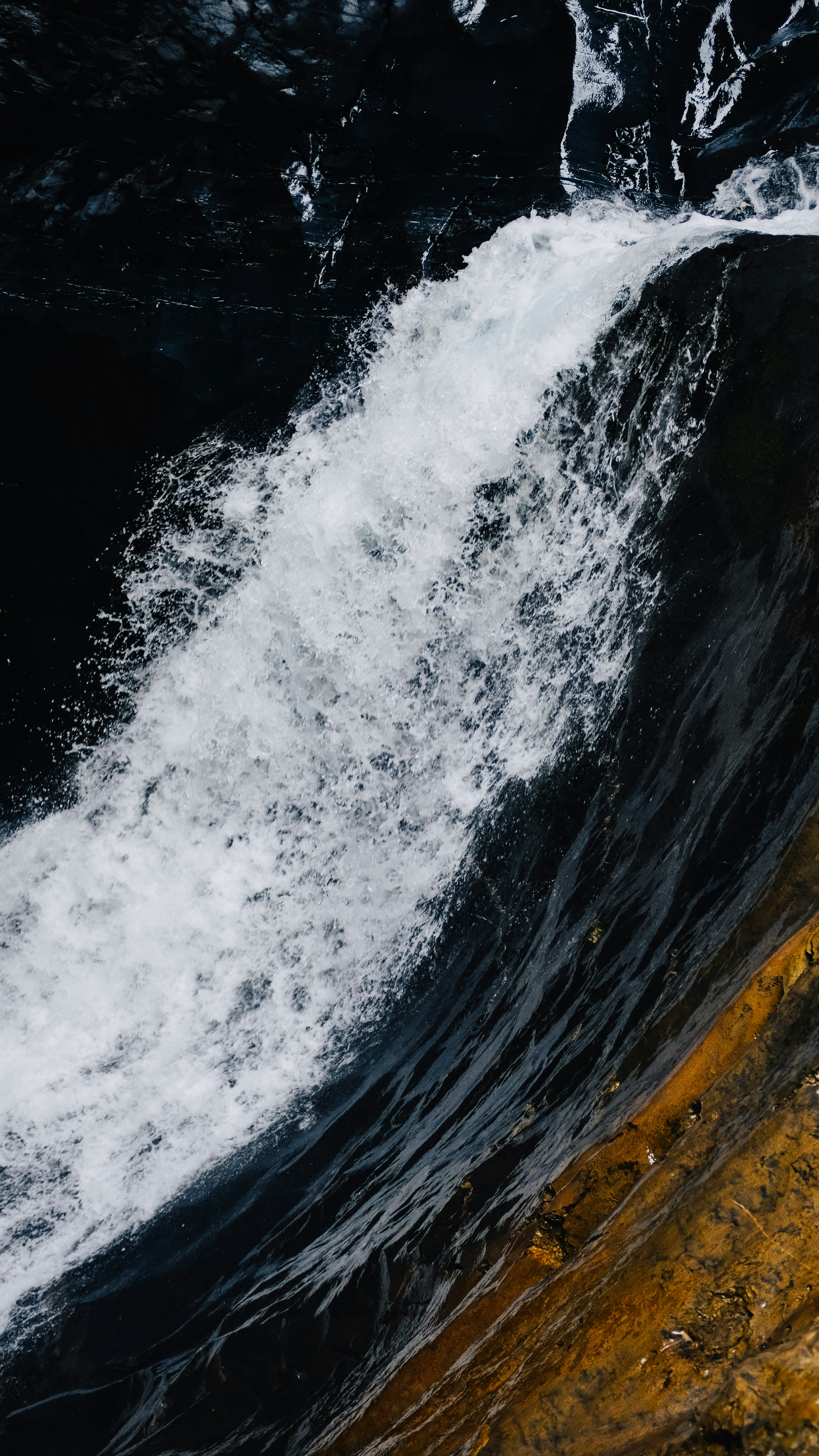 Rushing Waterfall Over Dark Rock