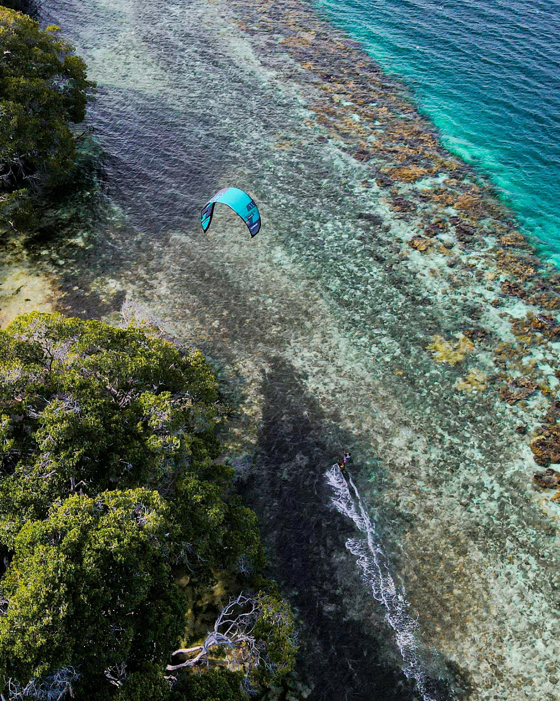 Kite Surfing Over Clear Shallow Reef