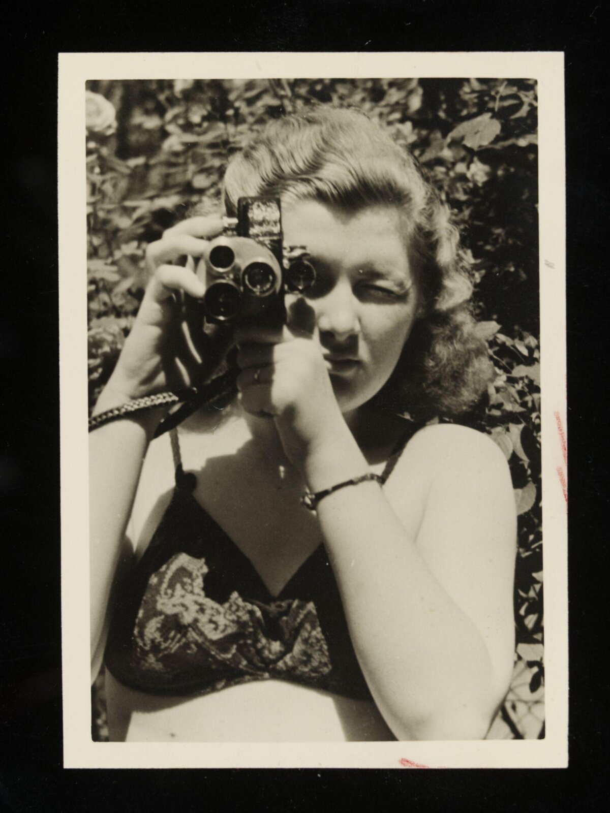Woman Taking Photo With Vintage Camera
