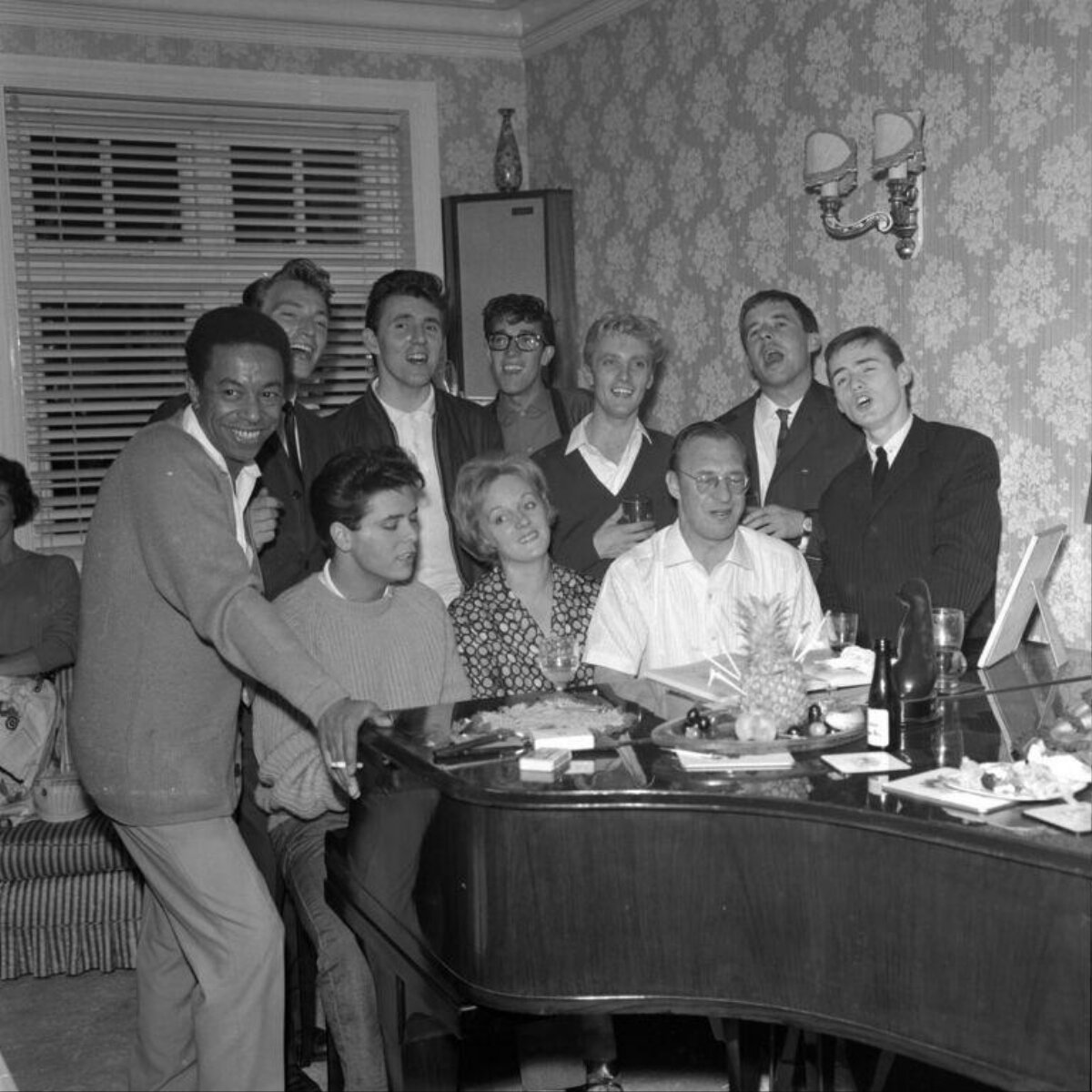 Group Singing Around Grand Piano