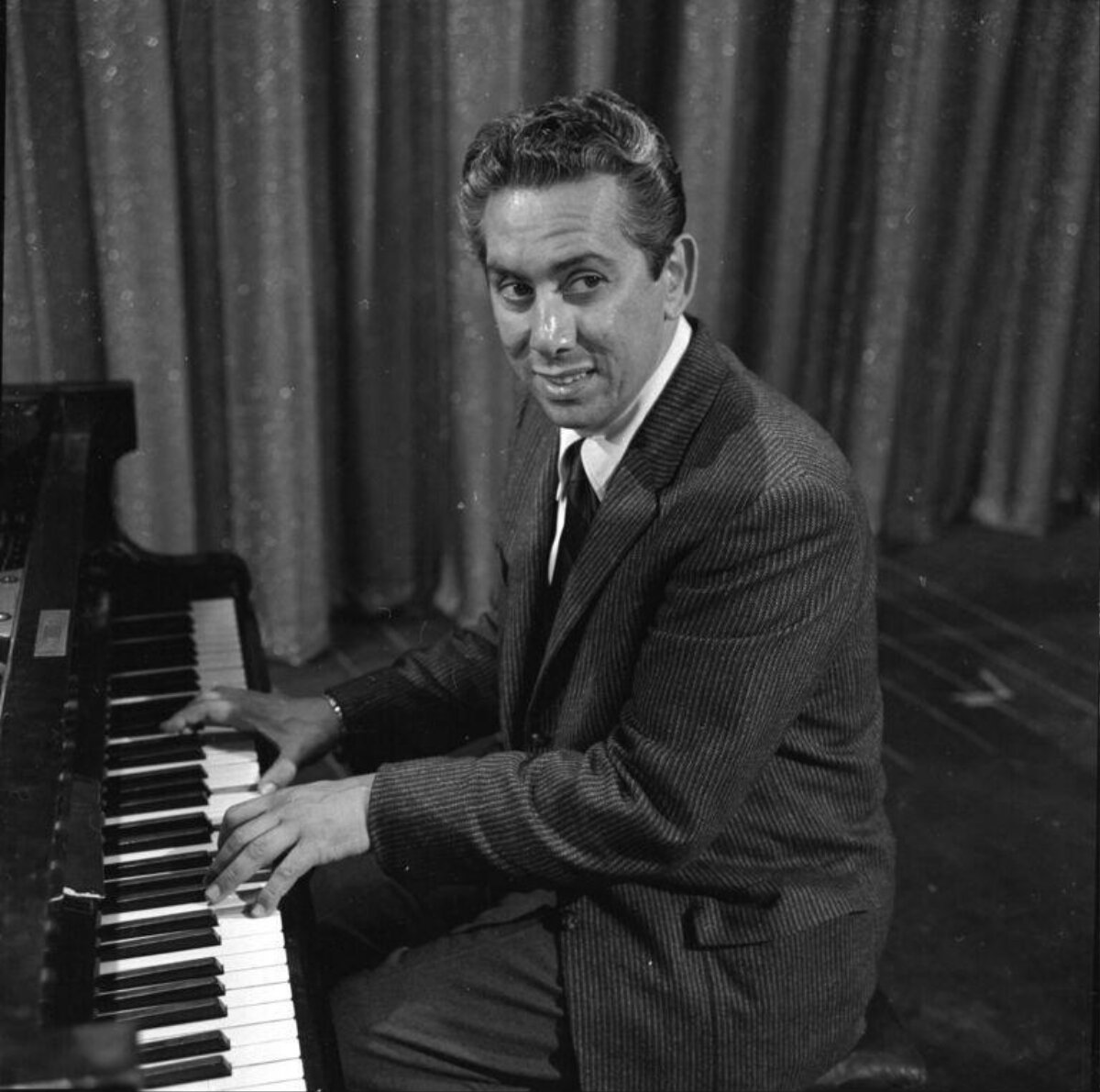 Man Playing Grand Piano