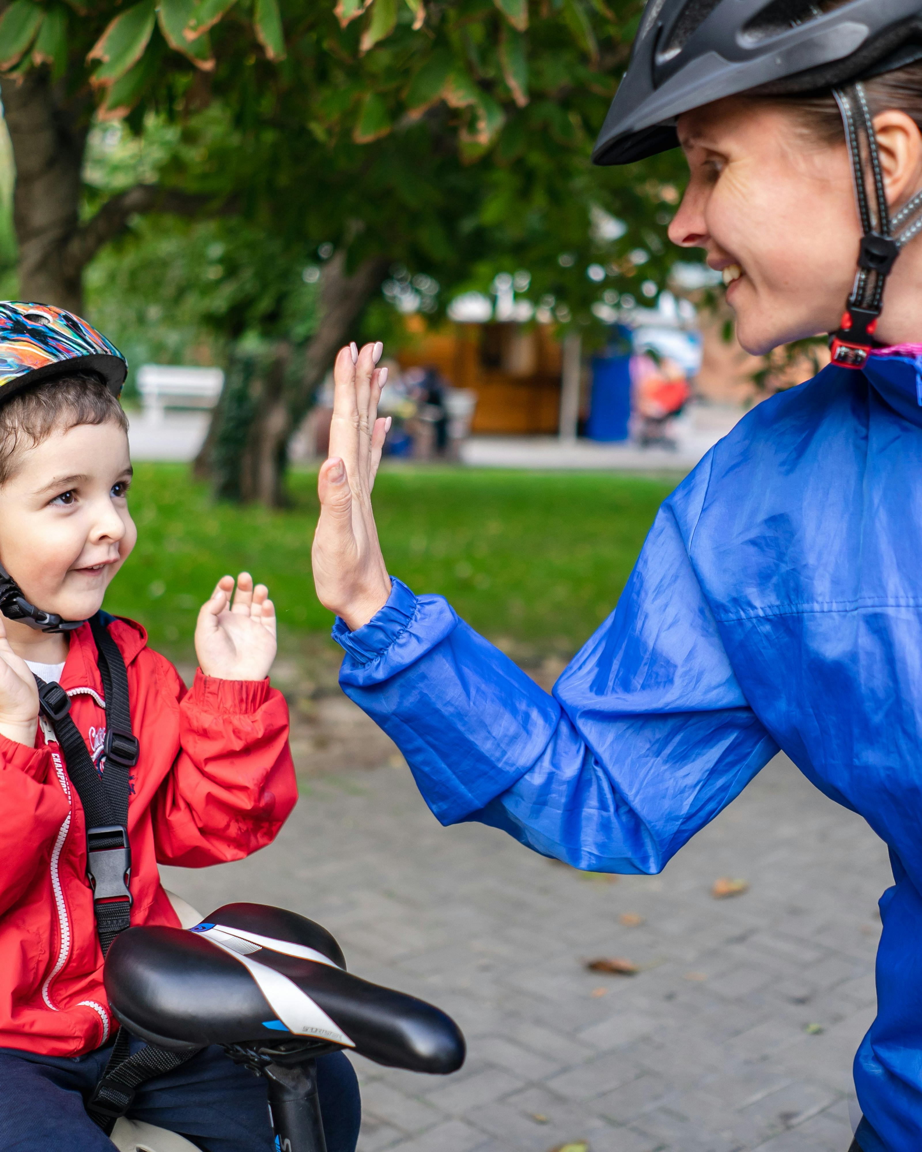 Adult and Child High Five After Cycling