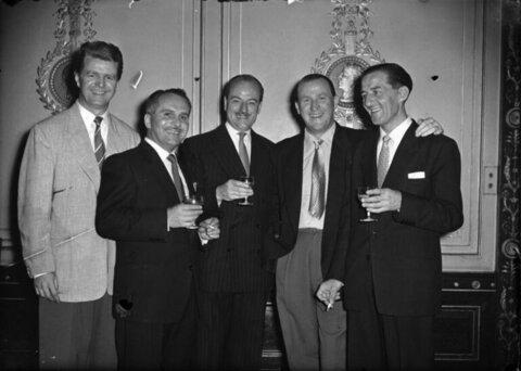 Five Men Posing With Drinks At Gathering
