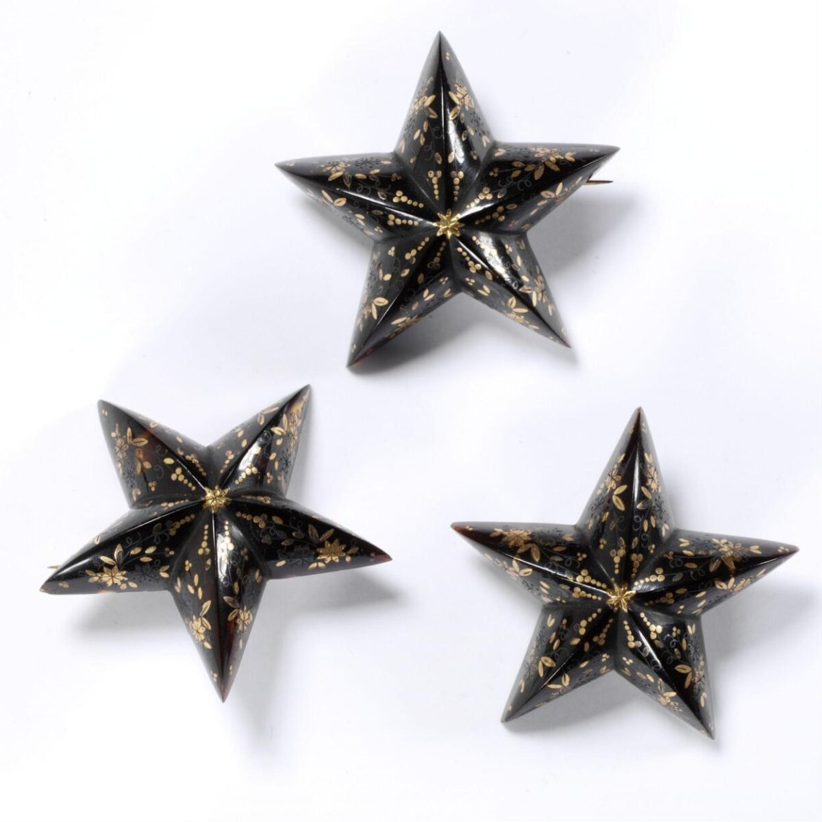 Three Black Gold Painted Star Brooches