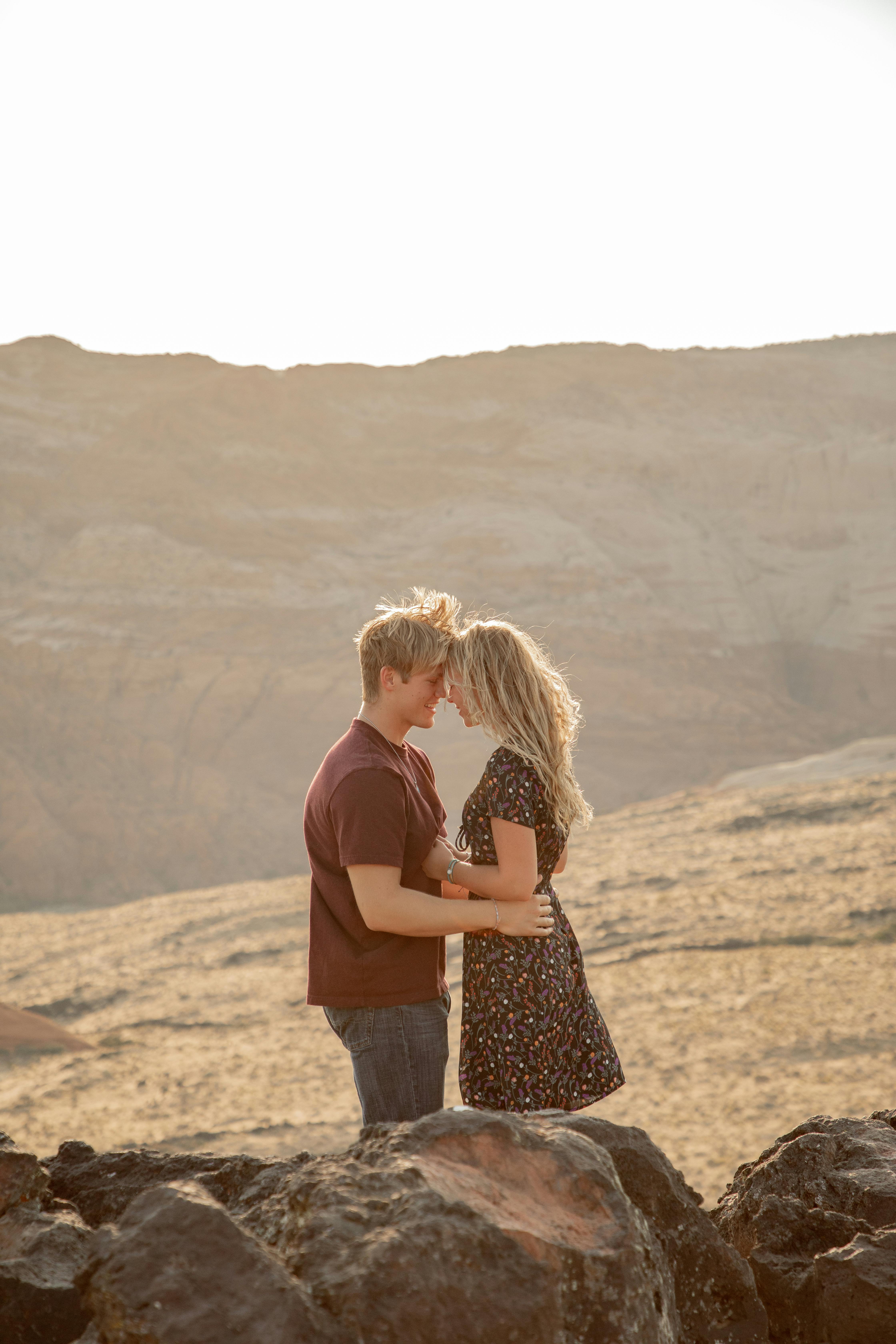 Couple Embracing in Desert Canyon