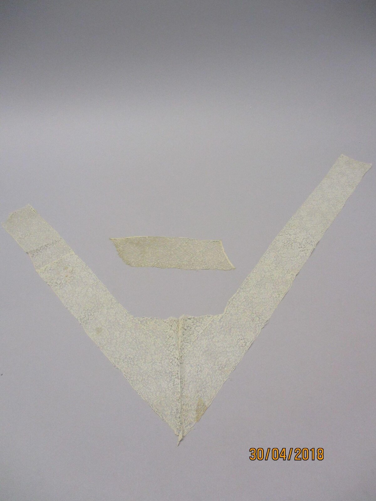 Antique Lace Fragments on Gray Background