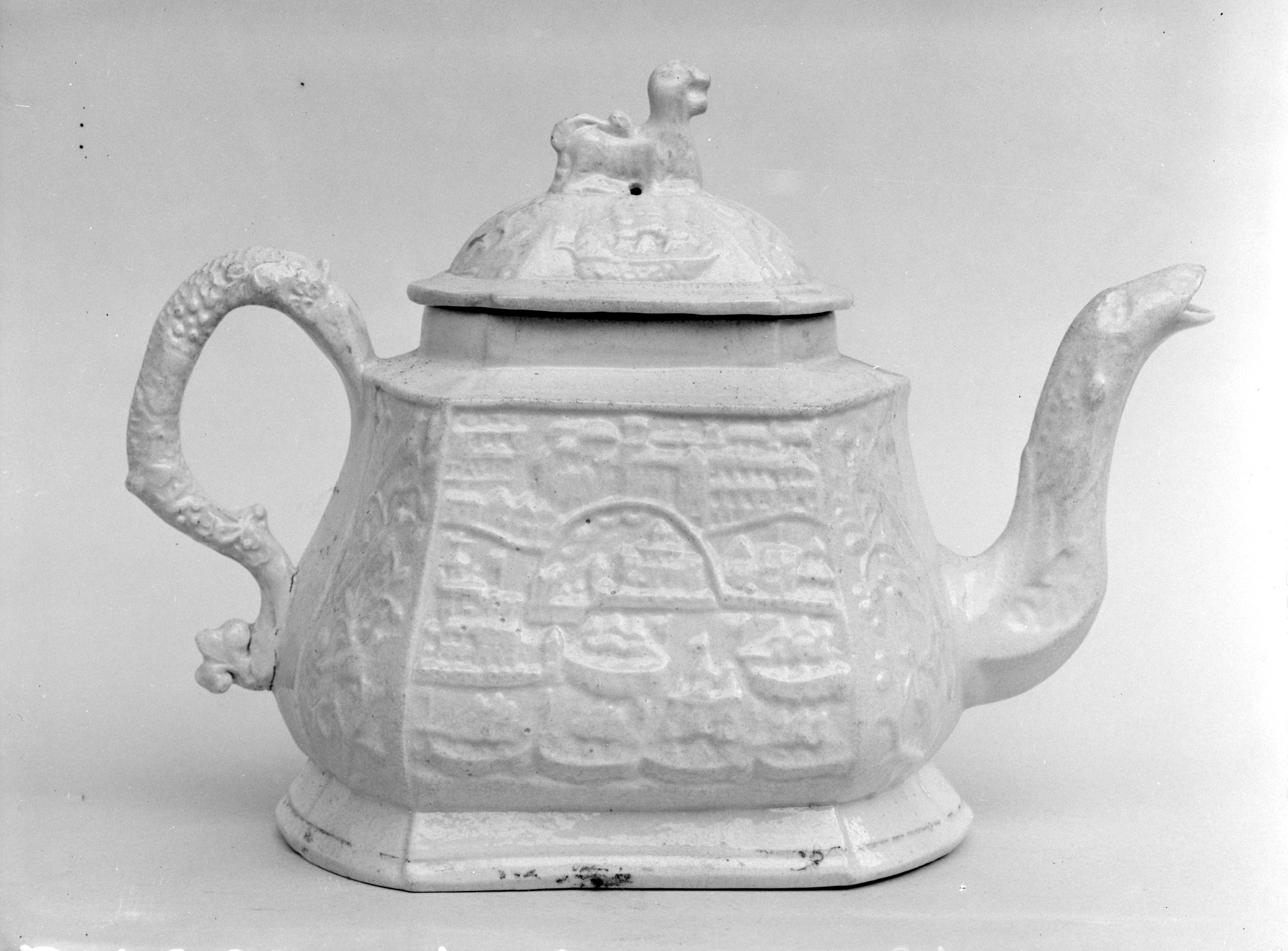 Antique Embossed White Ceramic Teapot