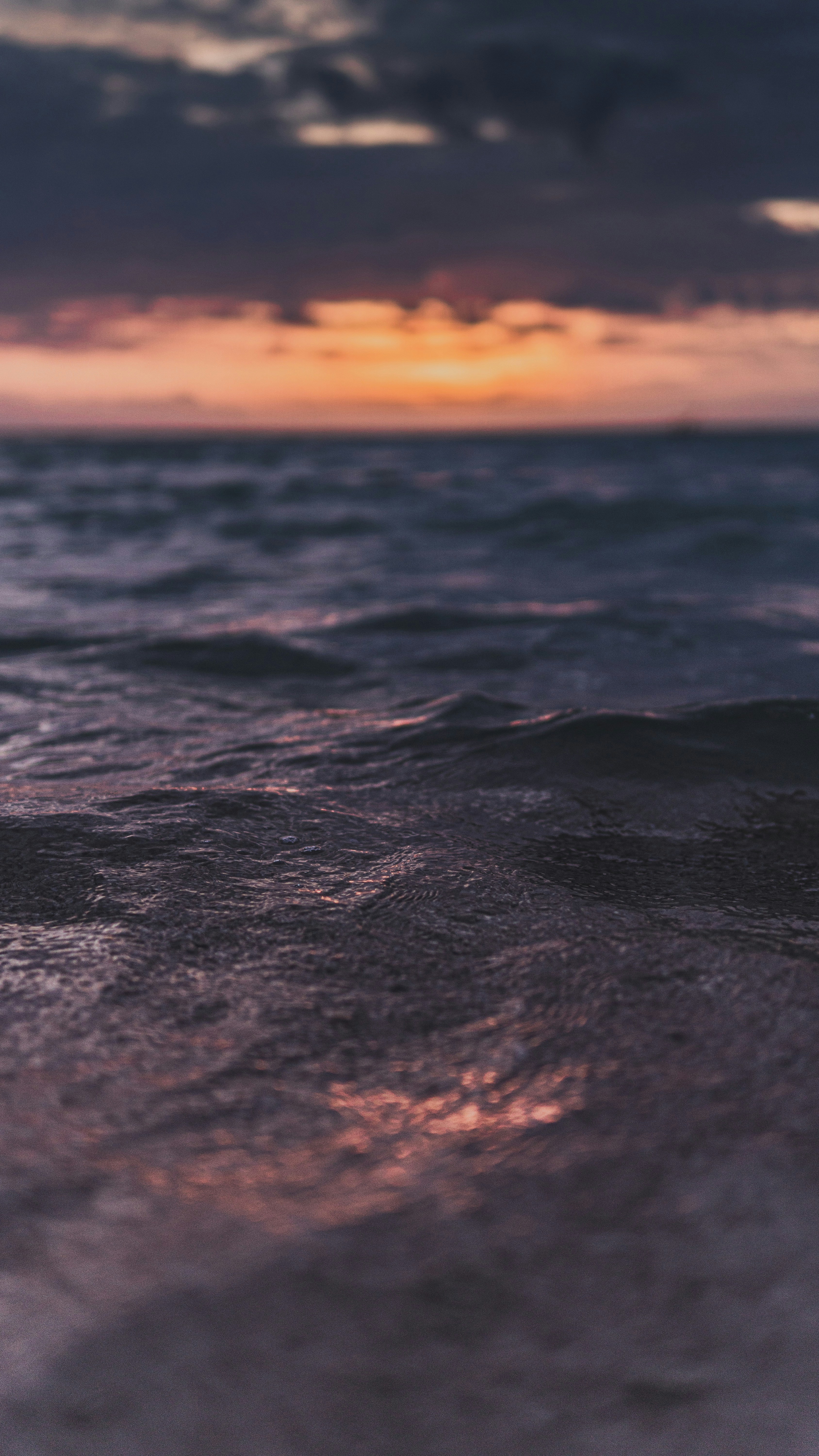 Sunset Over Sea Waves