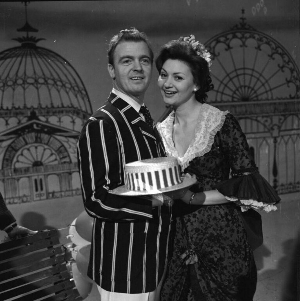 Vintage Couple Holding Striped Hat