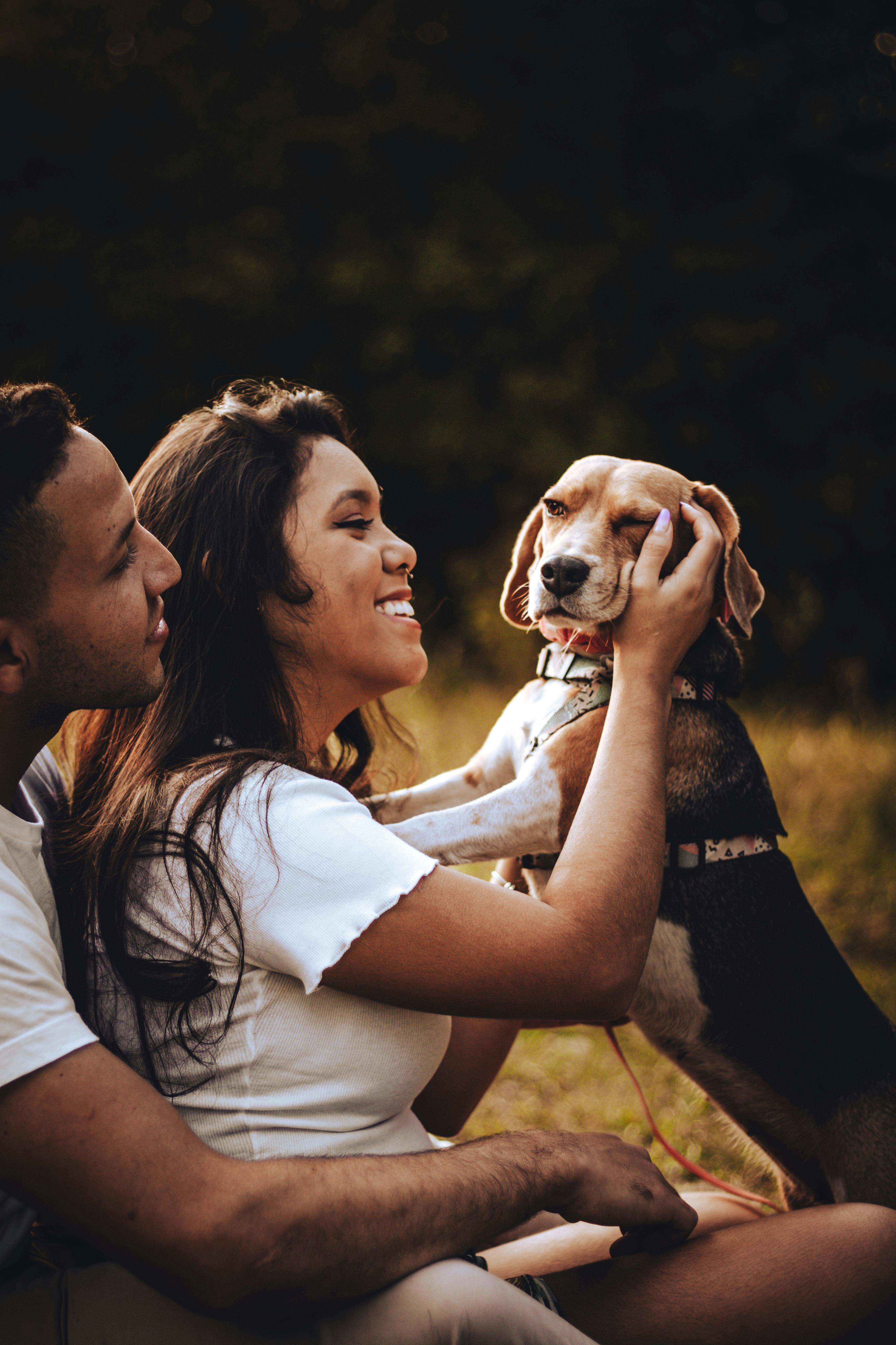 Couple With Pet Beagle Outdoors