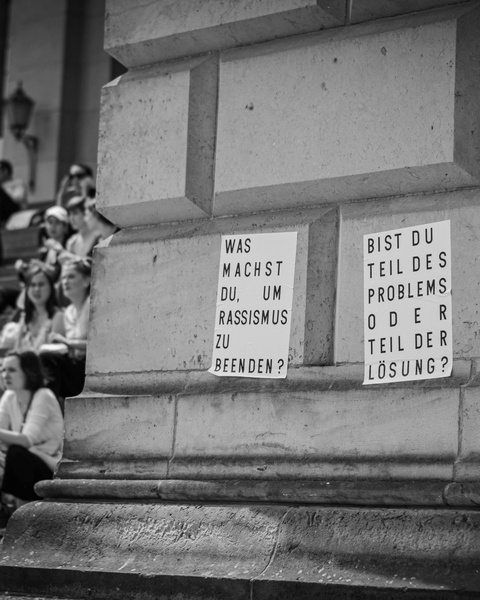 Anti-Racism Protest Posters on Stone Column
