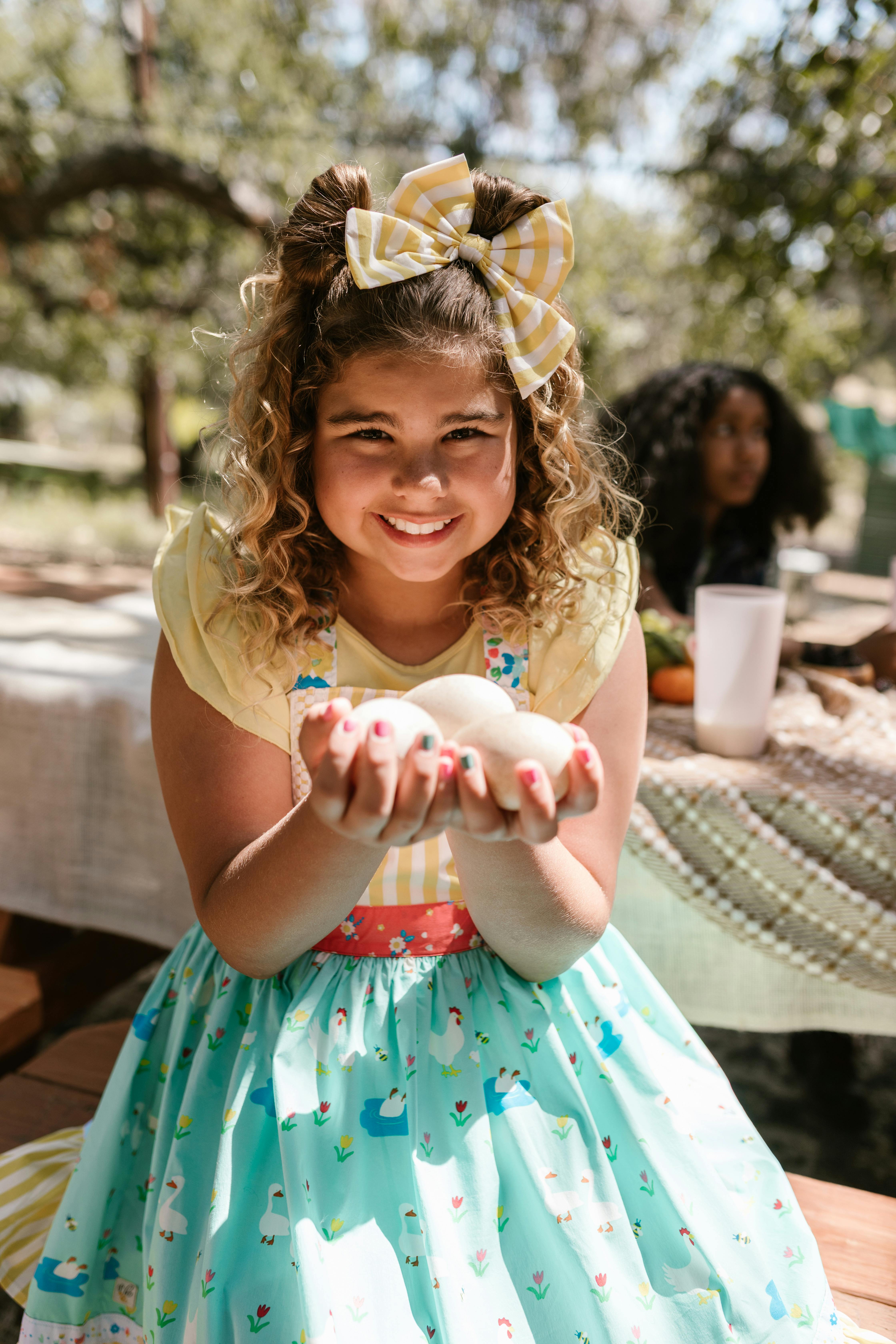 Smiling Girl Holding Fresh Eggs