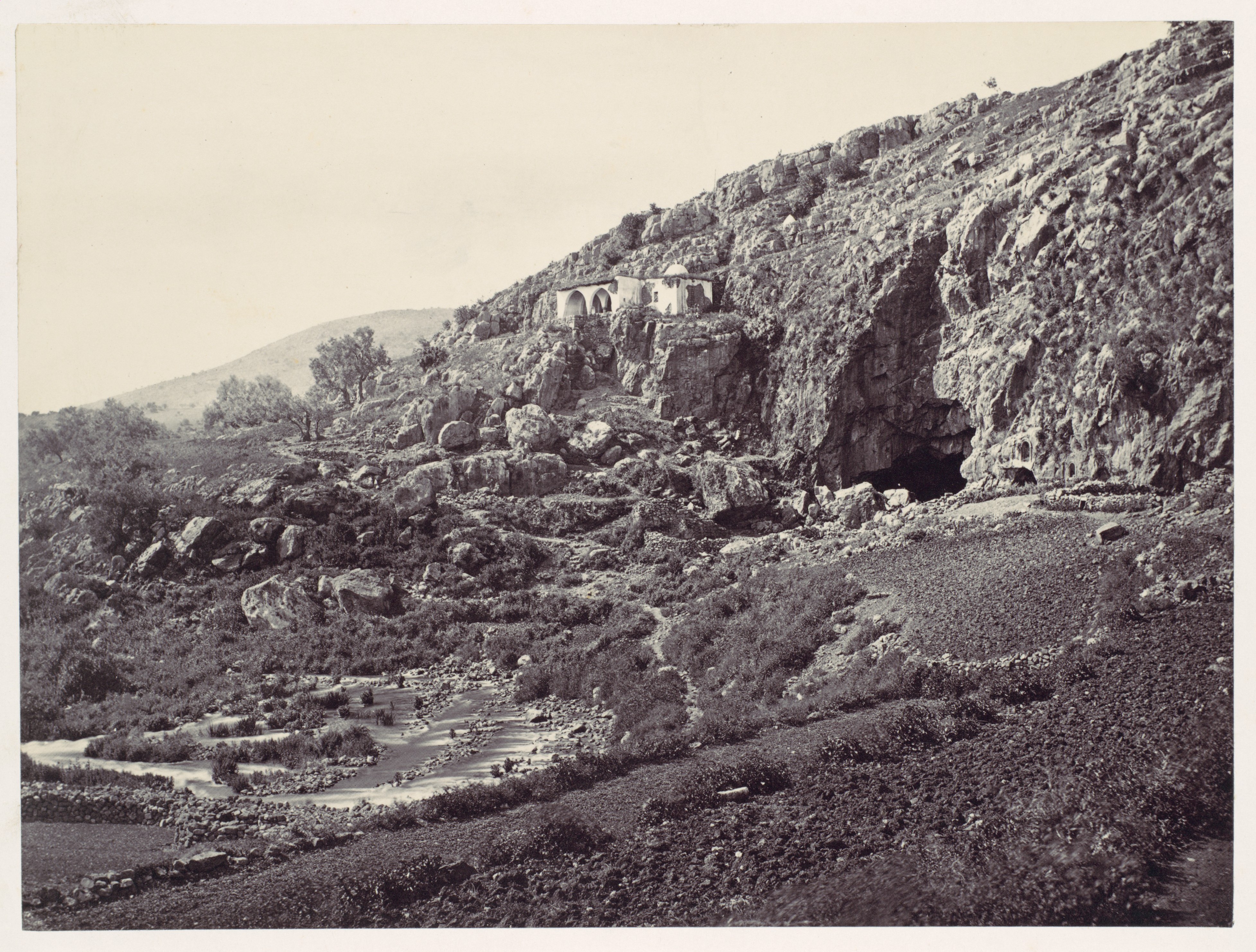 Shrine on Rocky Hillside by Stream