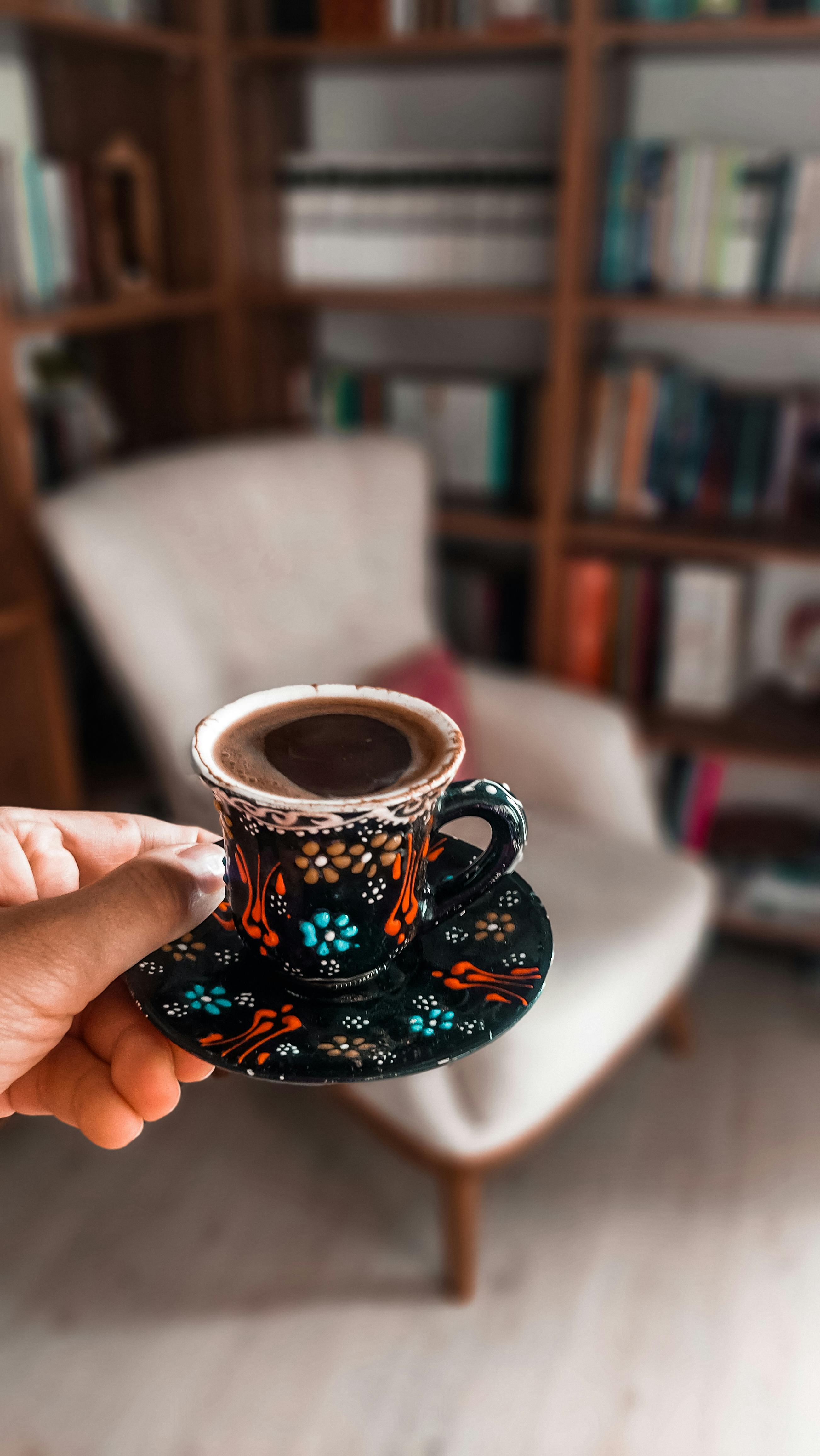 Hand Holding Traditional Turkish Coffee Cup