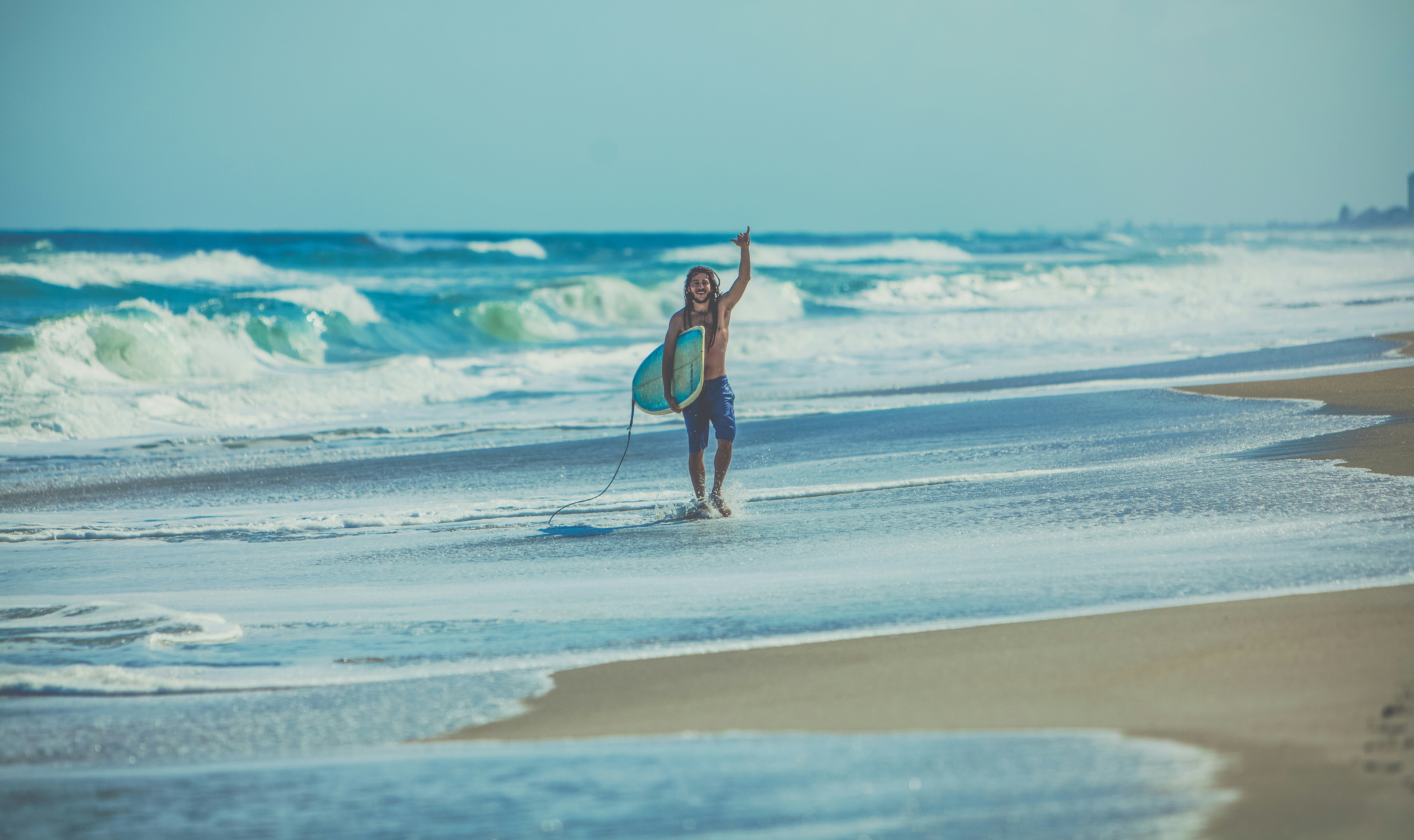 Happy Surfer on Beach After Surfing