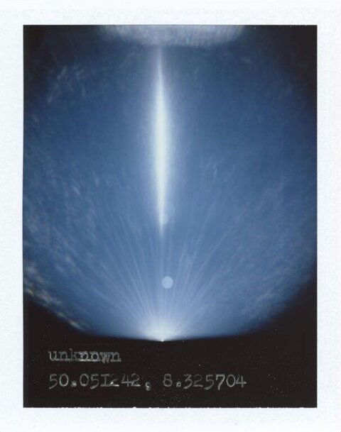 Vertical Light Beam in Night Sky