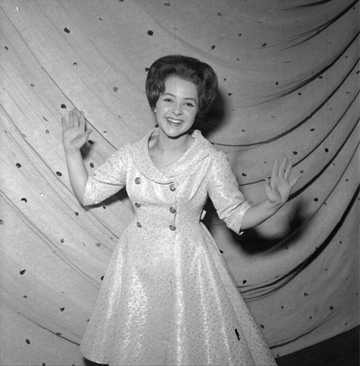 Smiling Woman Waving Both Hands