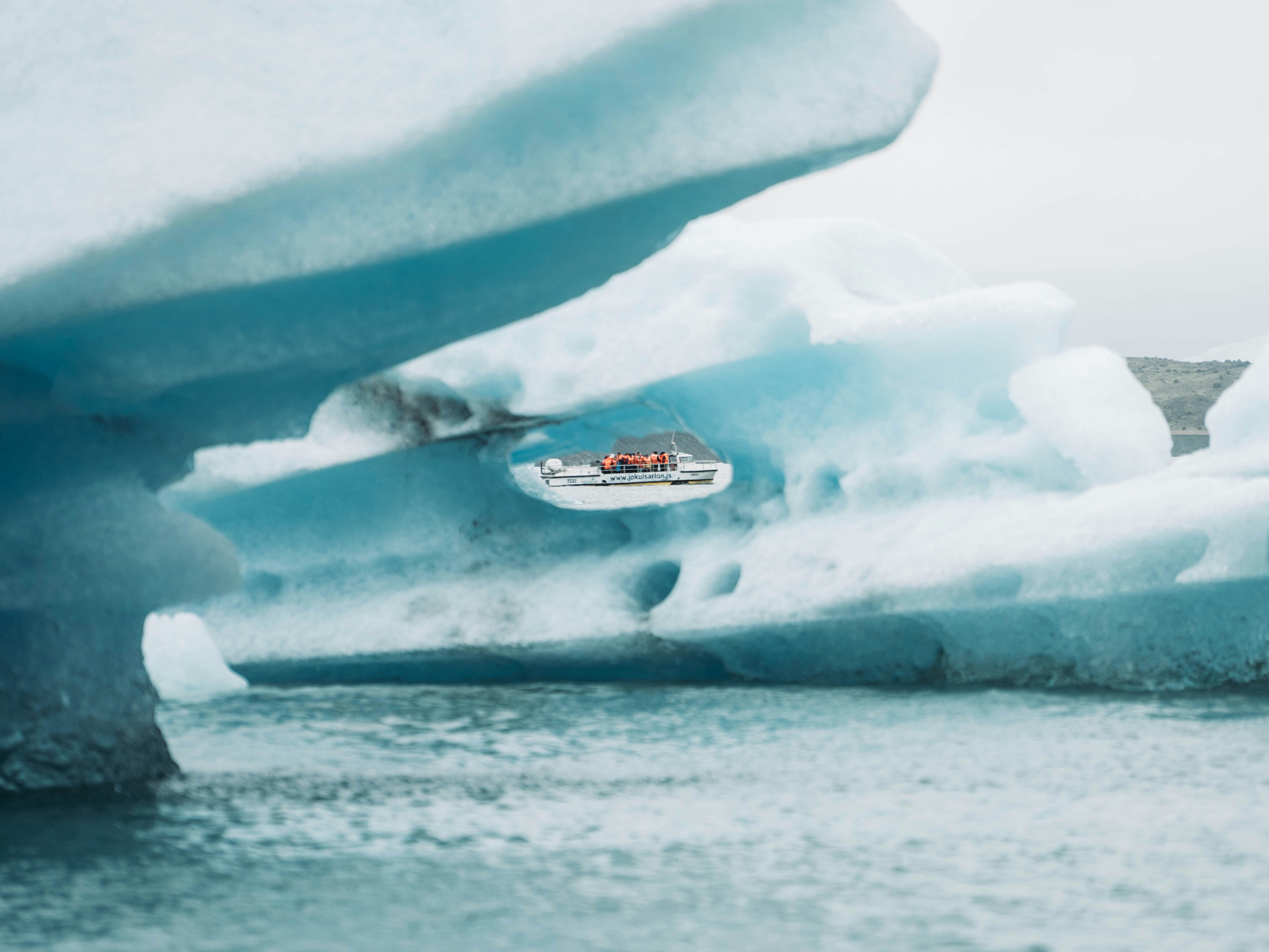 Tour Boat Framed by Iceberg