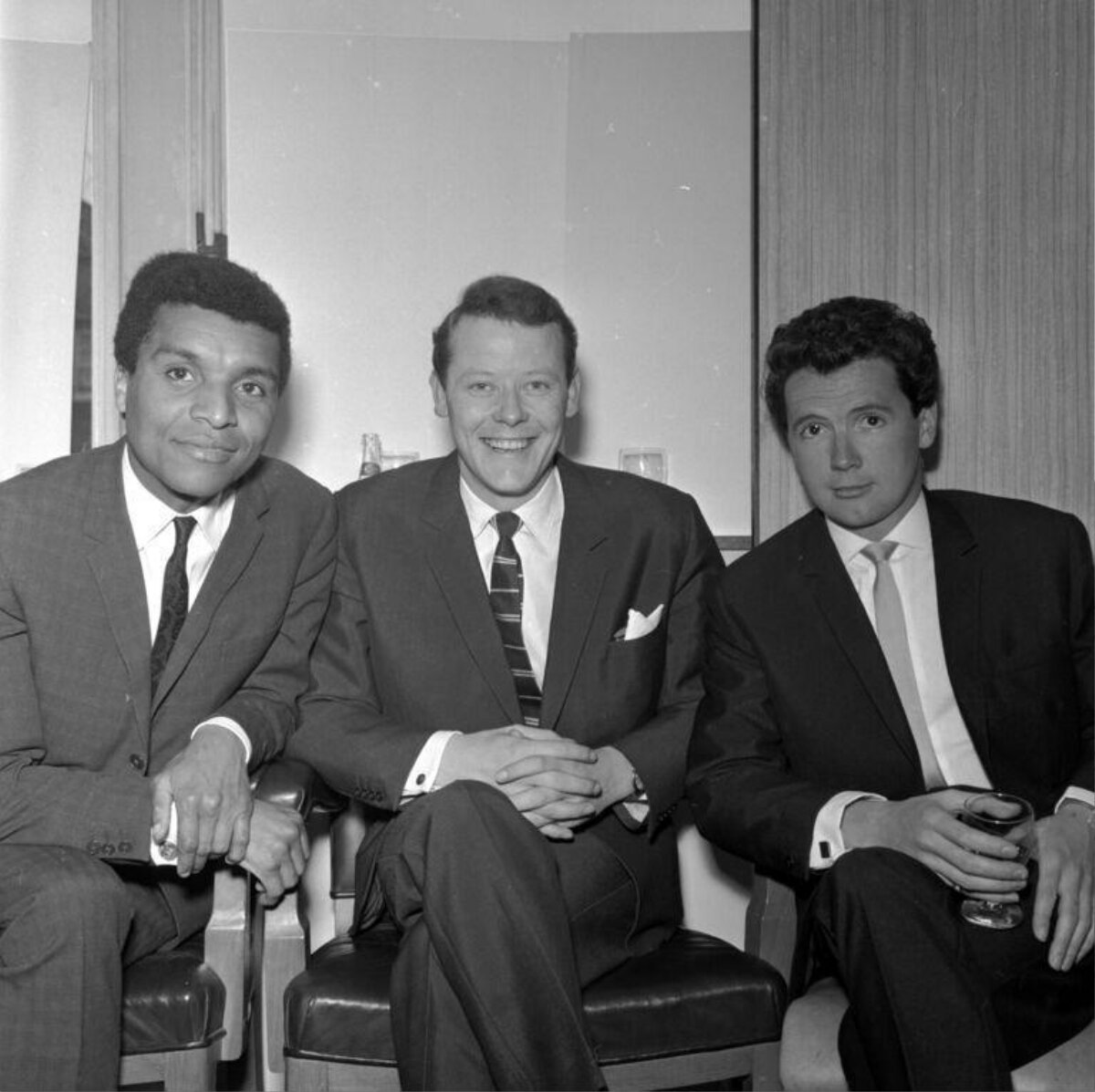 Three Men in Suits Posing for Photo