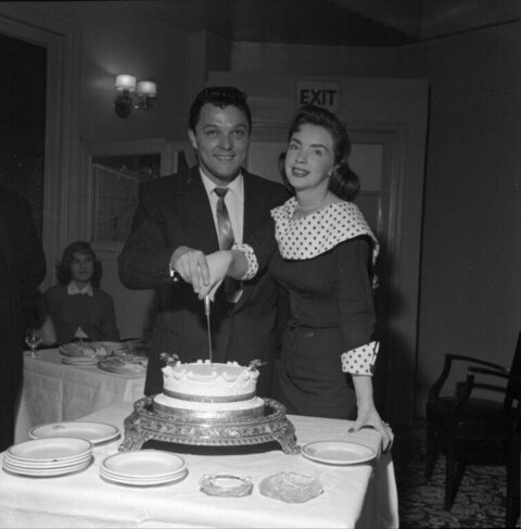Couple Cutting Celebration Cake