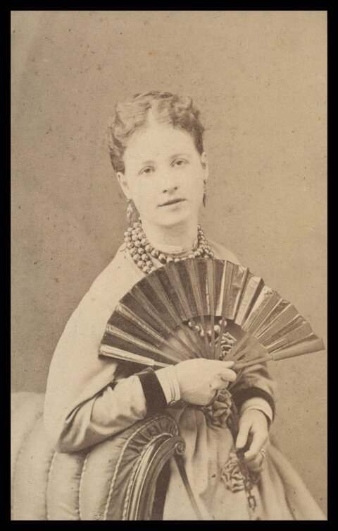Vintage Portrait of Woman Holding Fan
