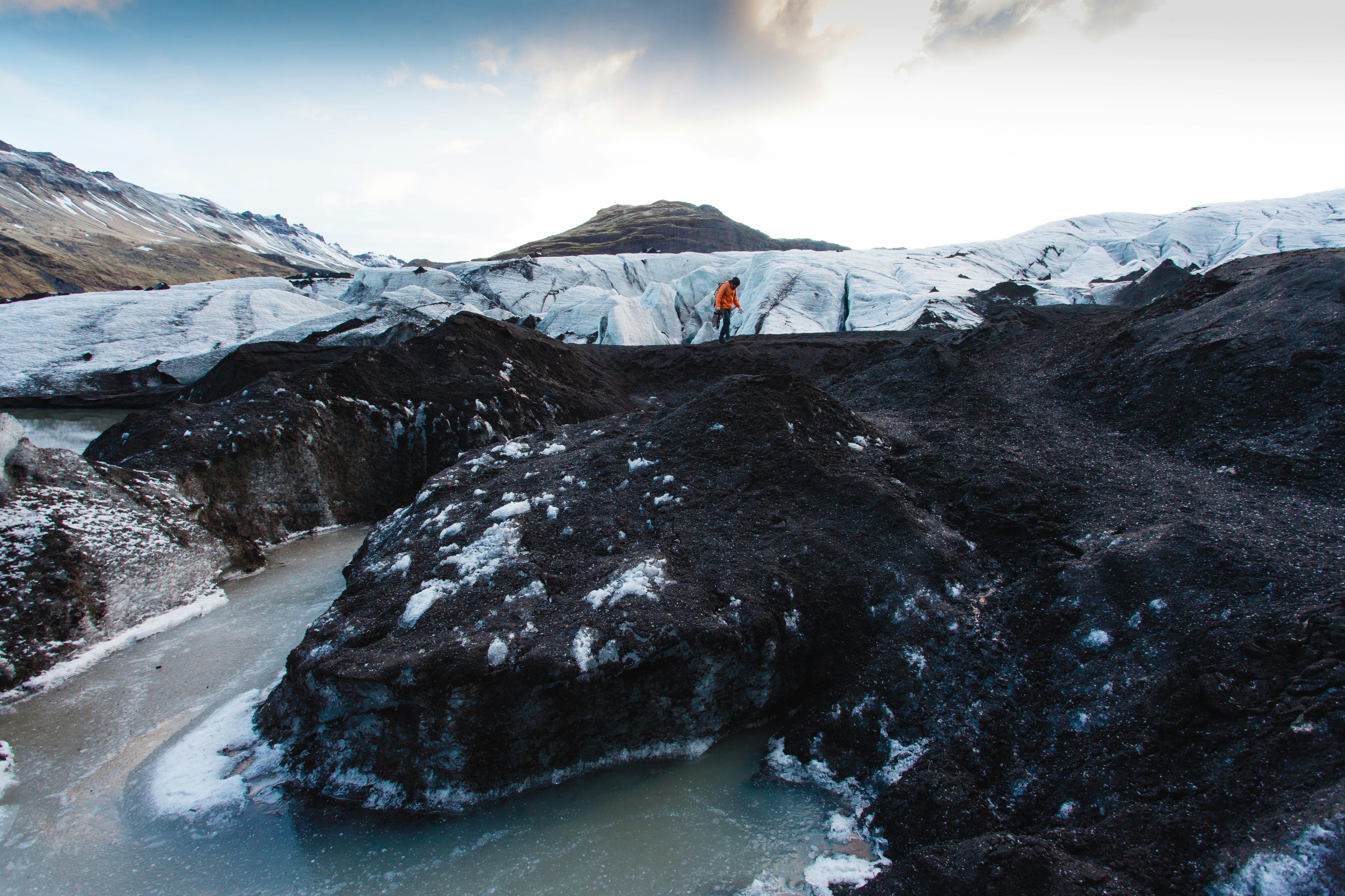Hiker Exploring Glacial Terrain