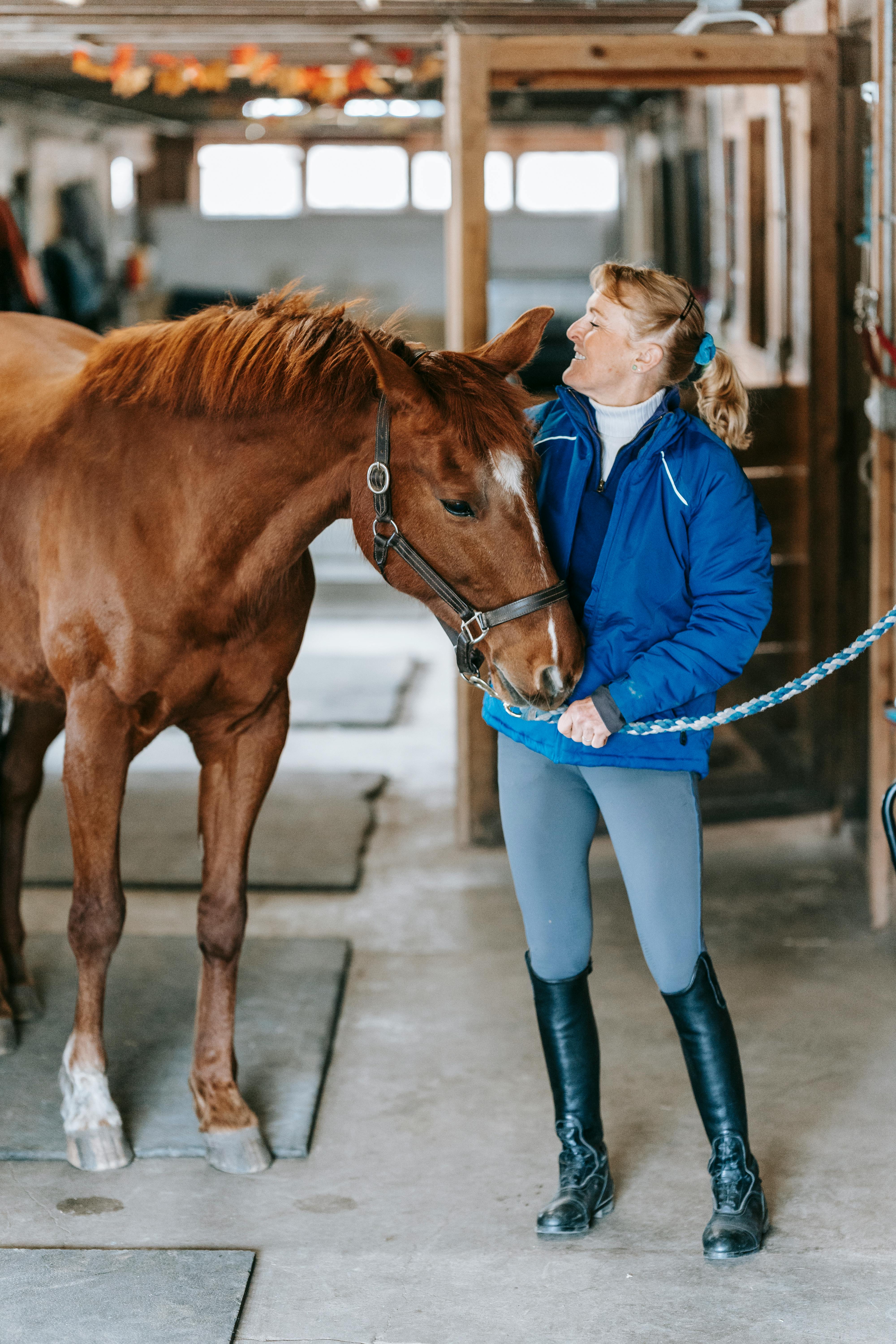 Woman and Horse in Stable