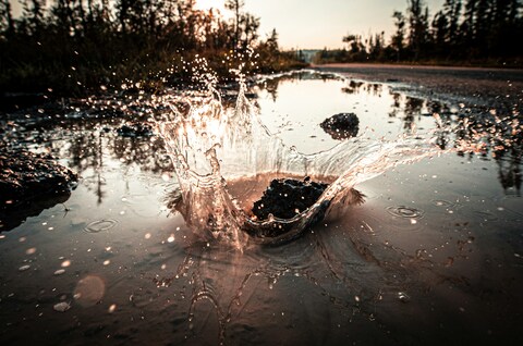 Water Splash in Roadside Puddle
