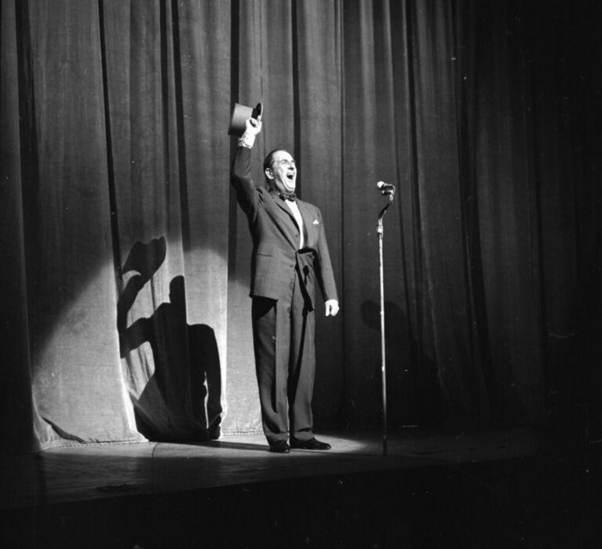 Stage Performer Saluting With Top Hat