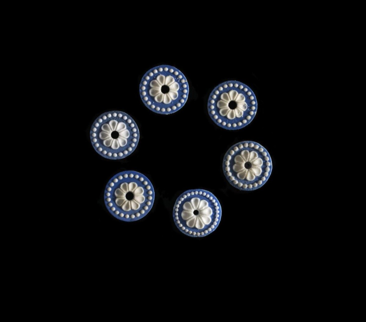 Six Blue White Floral Buttons on Black