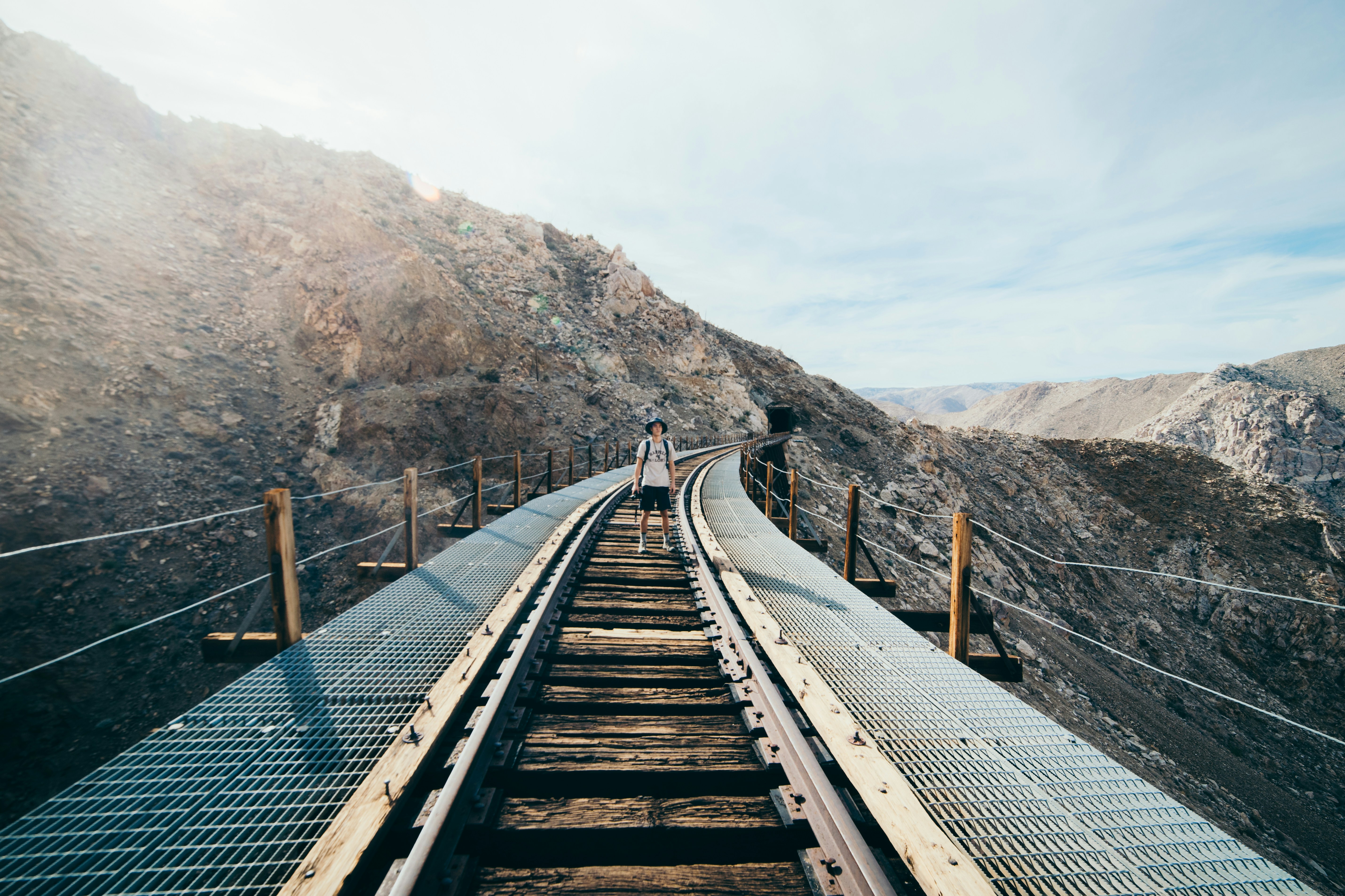 Hiker on Mountain Railway Bridge