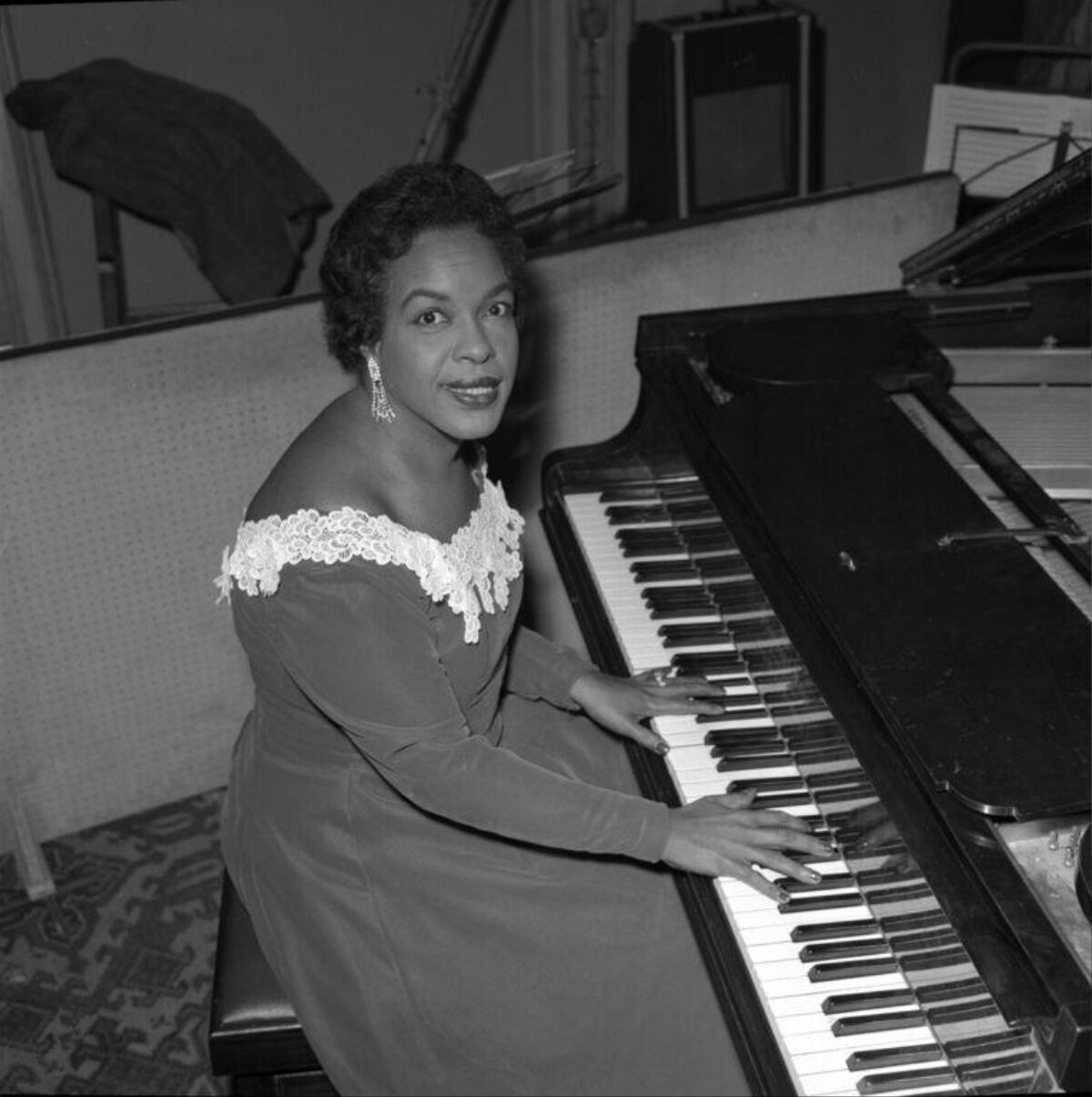 Woman Playing Grand Piano