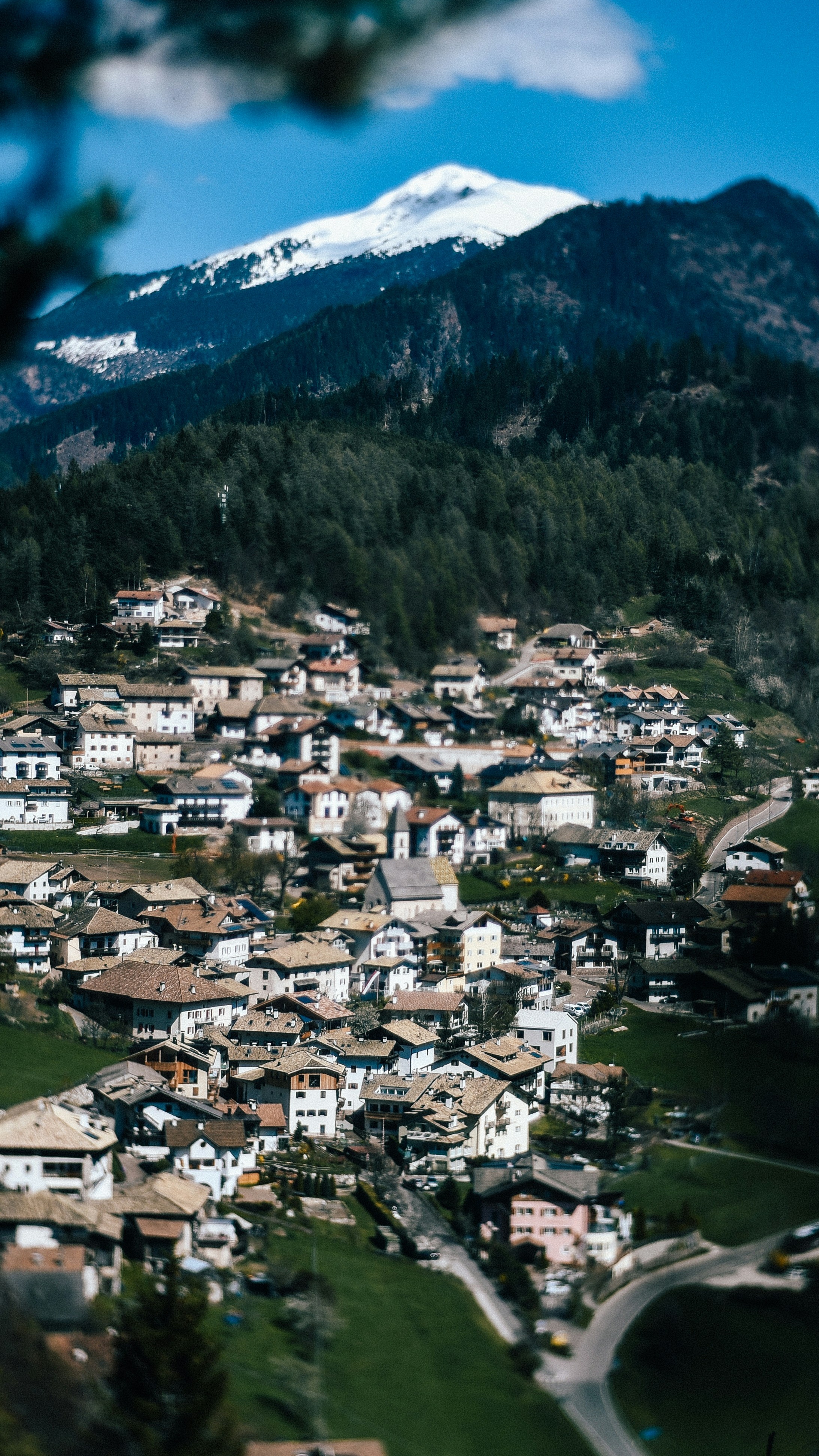 Alpine Village under Snow-capped Mountain