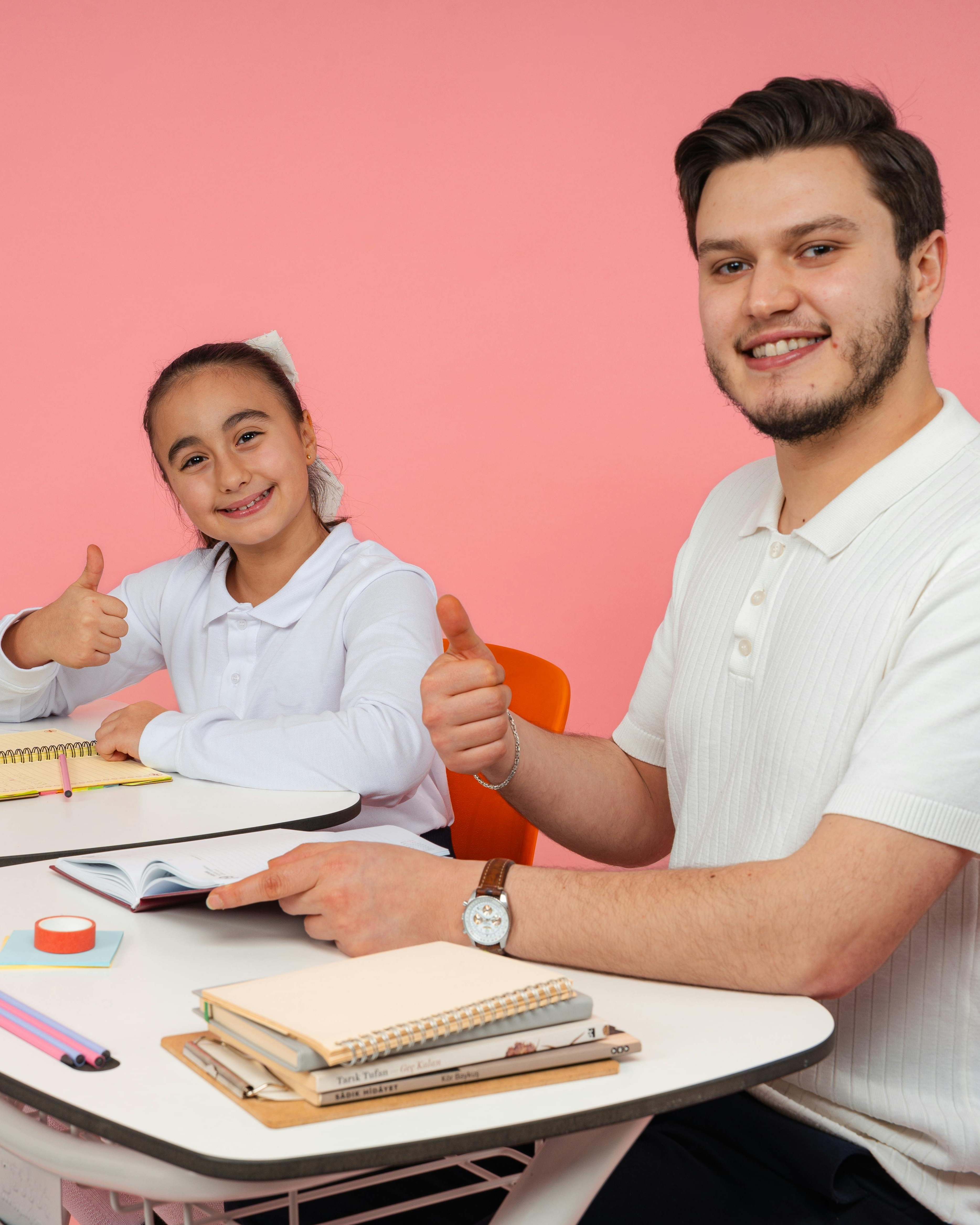 Tutor and Student Giving Thumbs Up