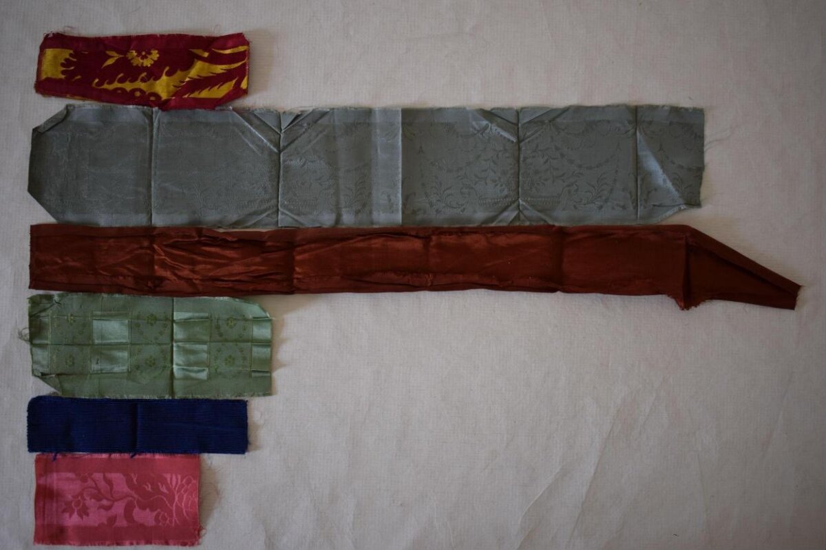 Various Fabric Strips on Plain Background